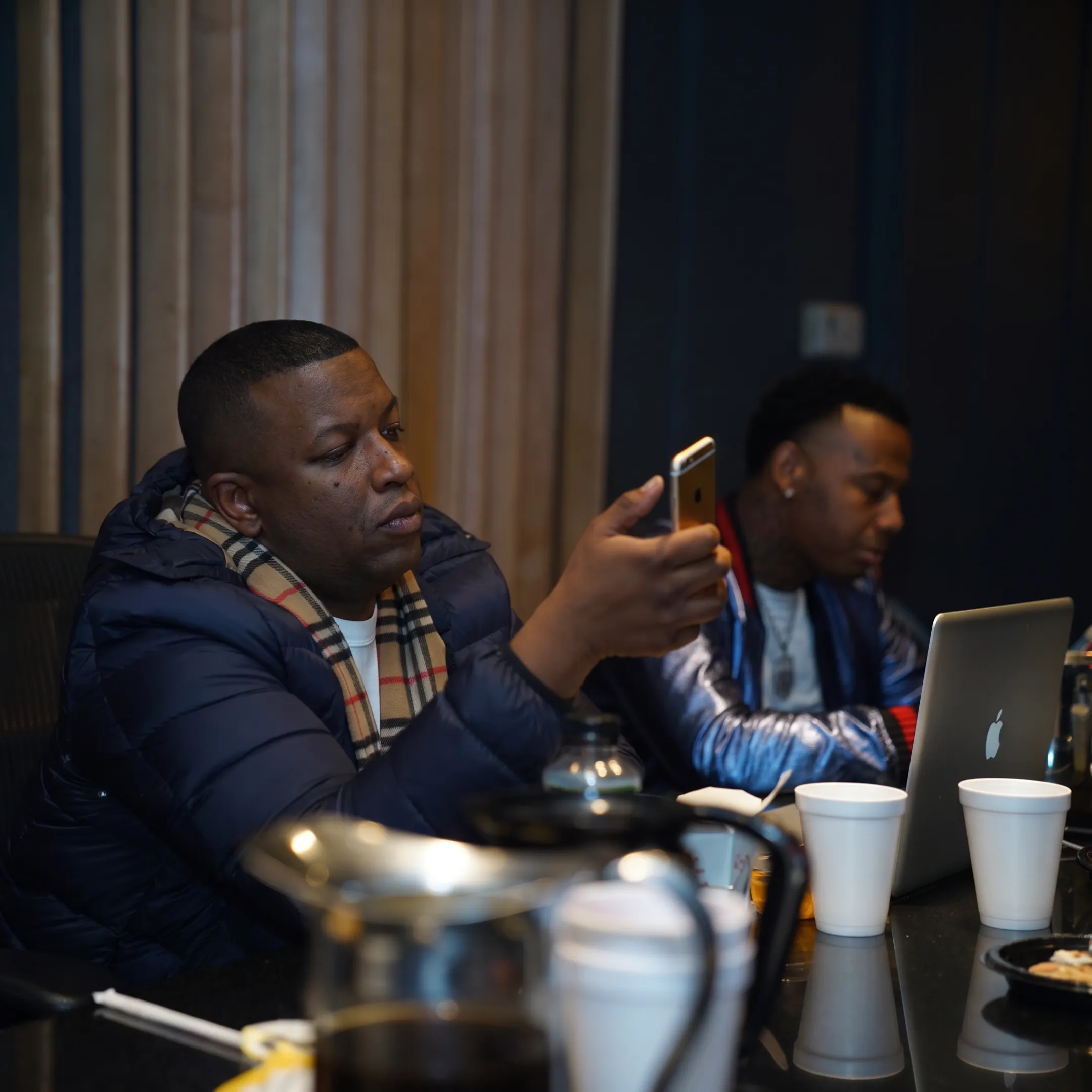 Artist development meeting with music professional and artist reviewing career strategy