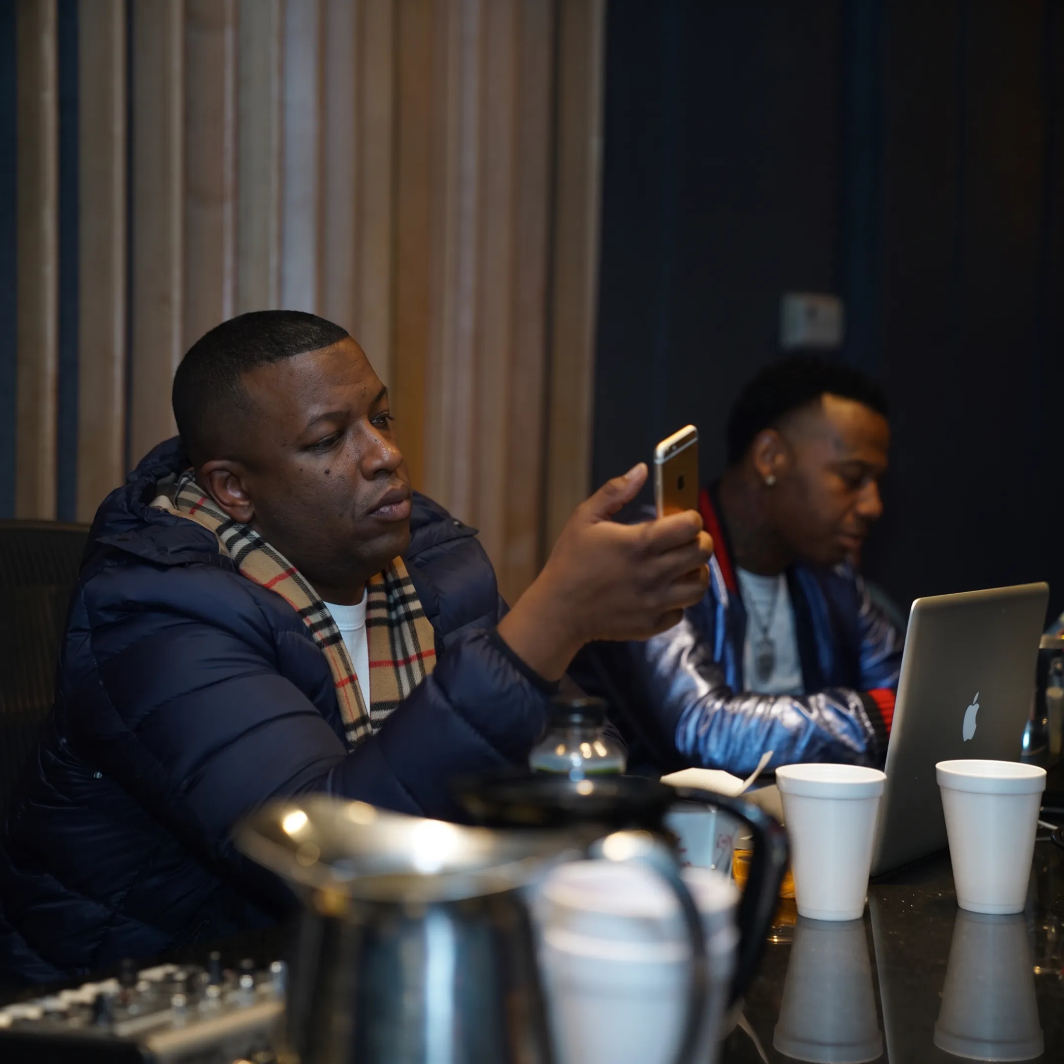 Music marketing team planning an artist campaign with digital content and promotional materials