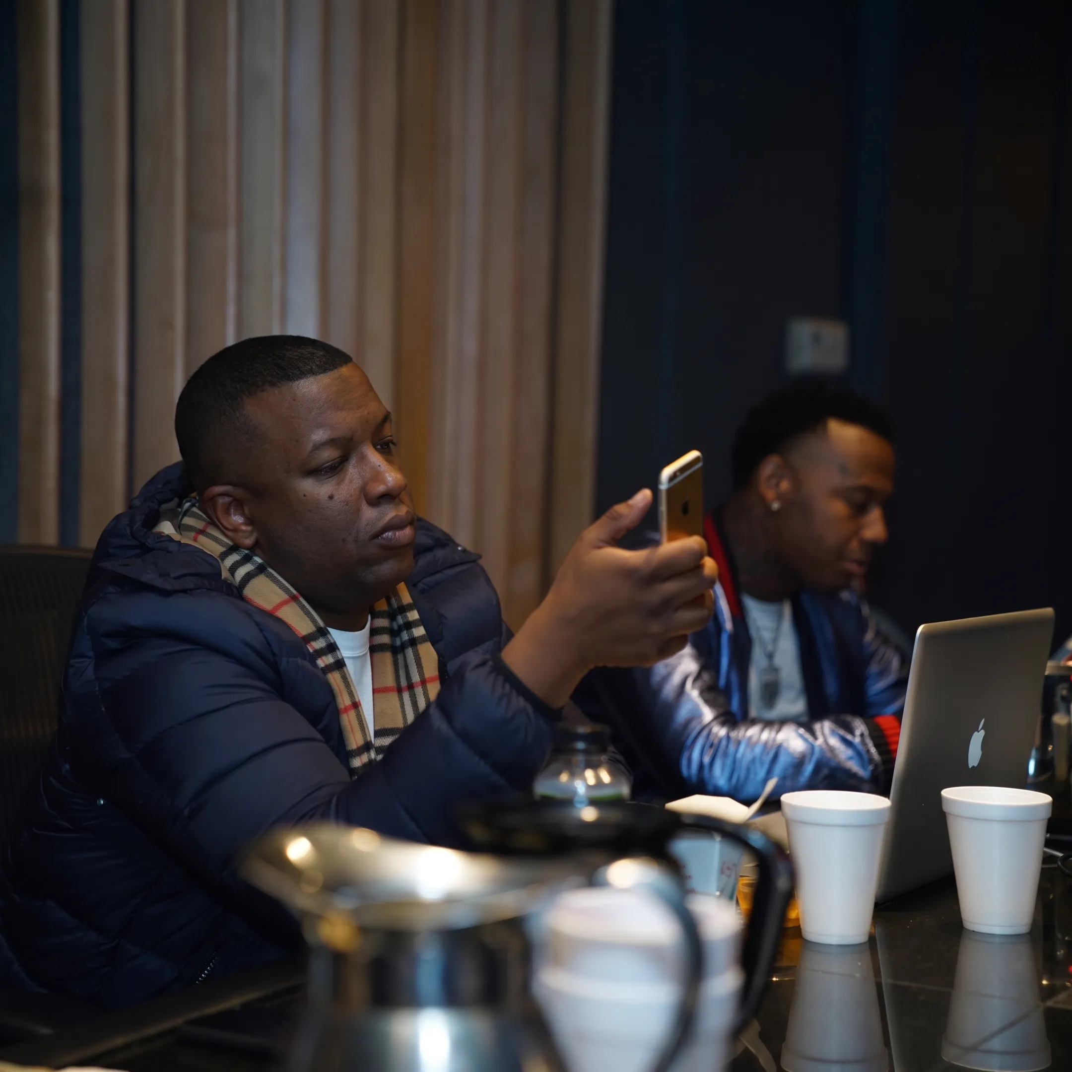 Artist working with a branding consultant in a creative studio
