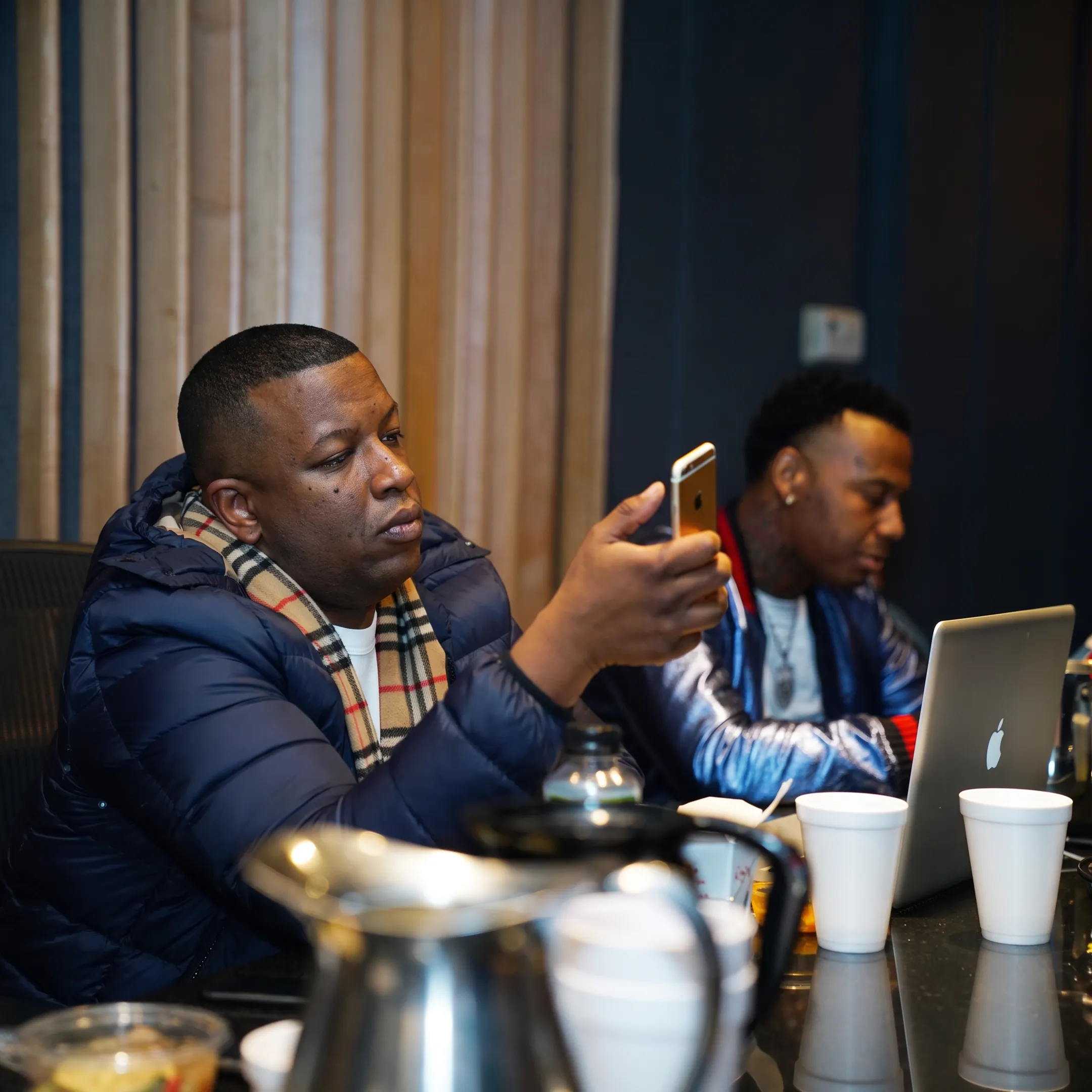 Music manager meeting with recording artist to discuss career strategy and promotional plans