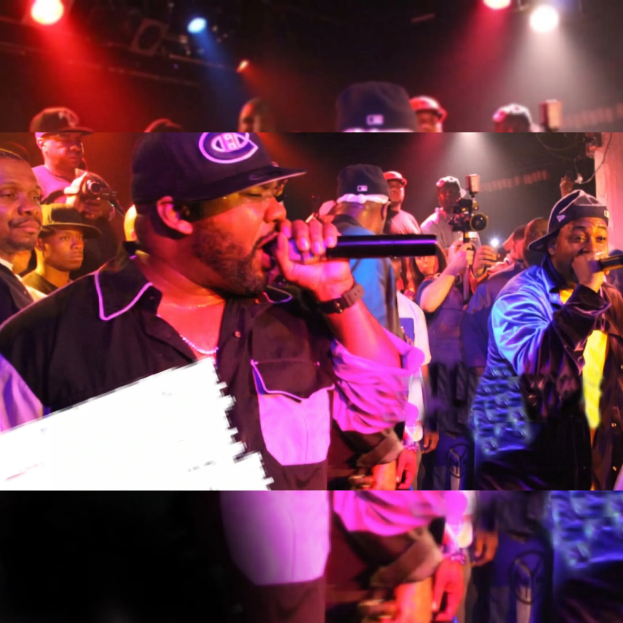 Independent hip-hop artist performing onstage before an engaged live audience
