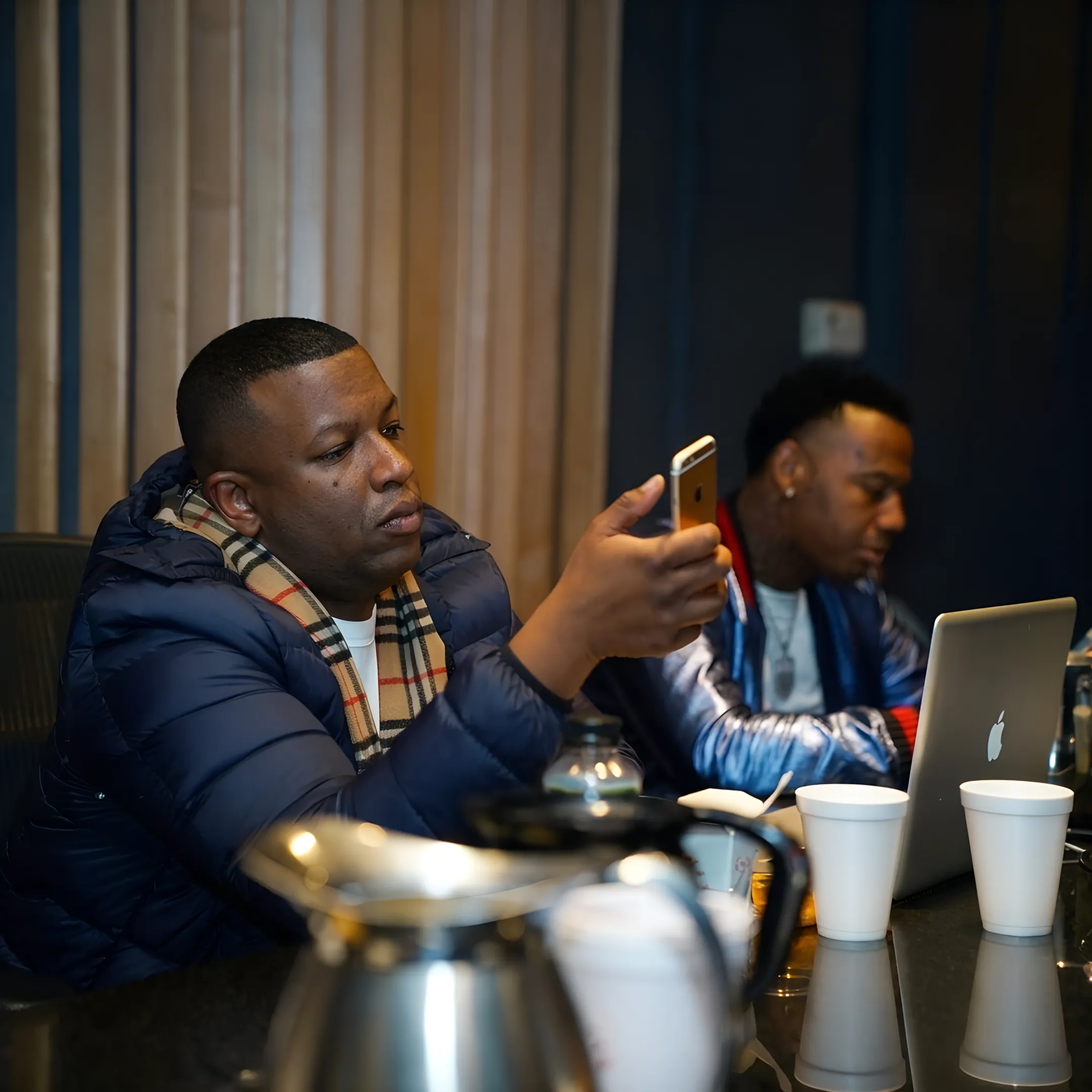 Booking professional discussing a live performance plan with an independent hip-hop artist
