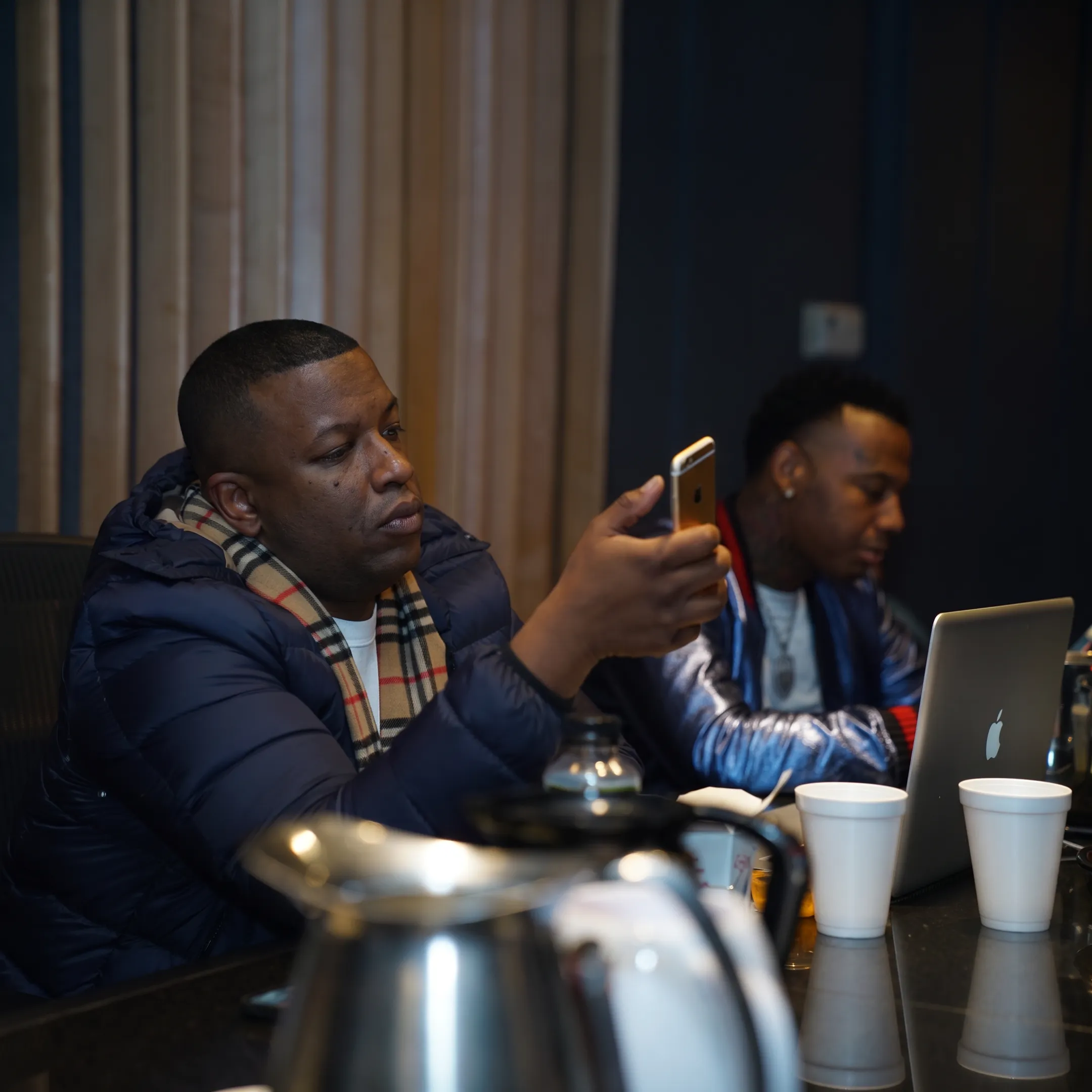 Music manager meeting with recording artist in a Dallas studio
