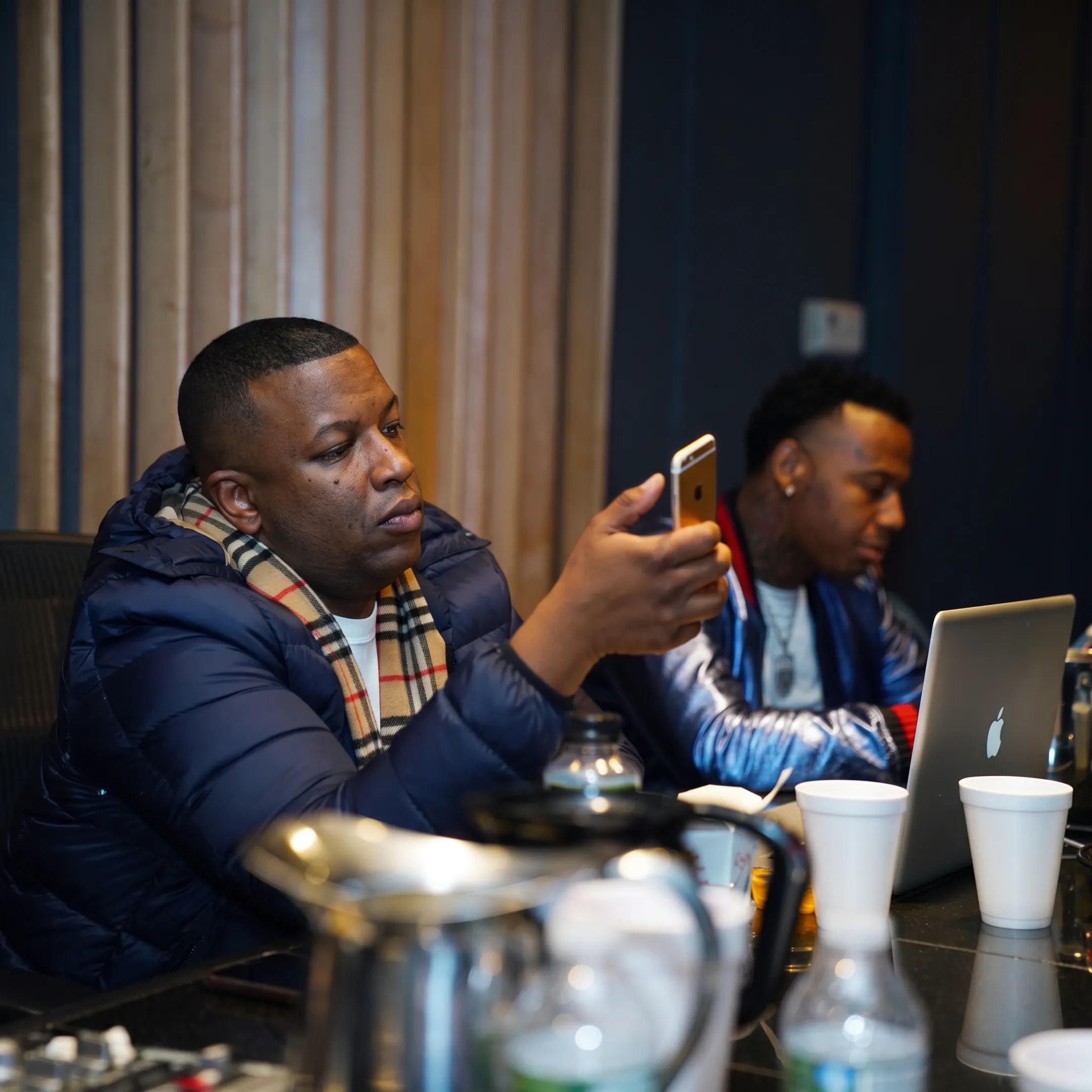 Music strategist reviewing an independent artist playlist campaign in a creative studio