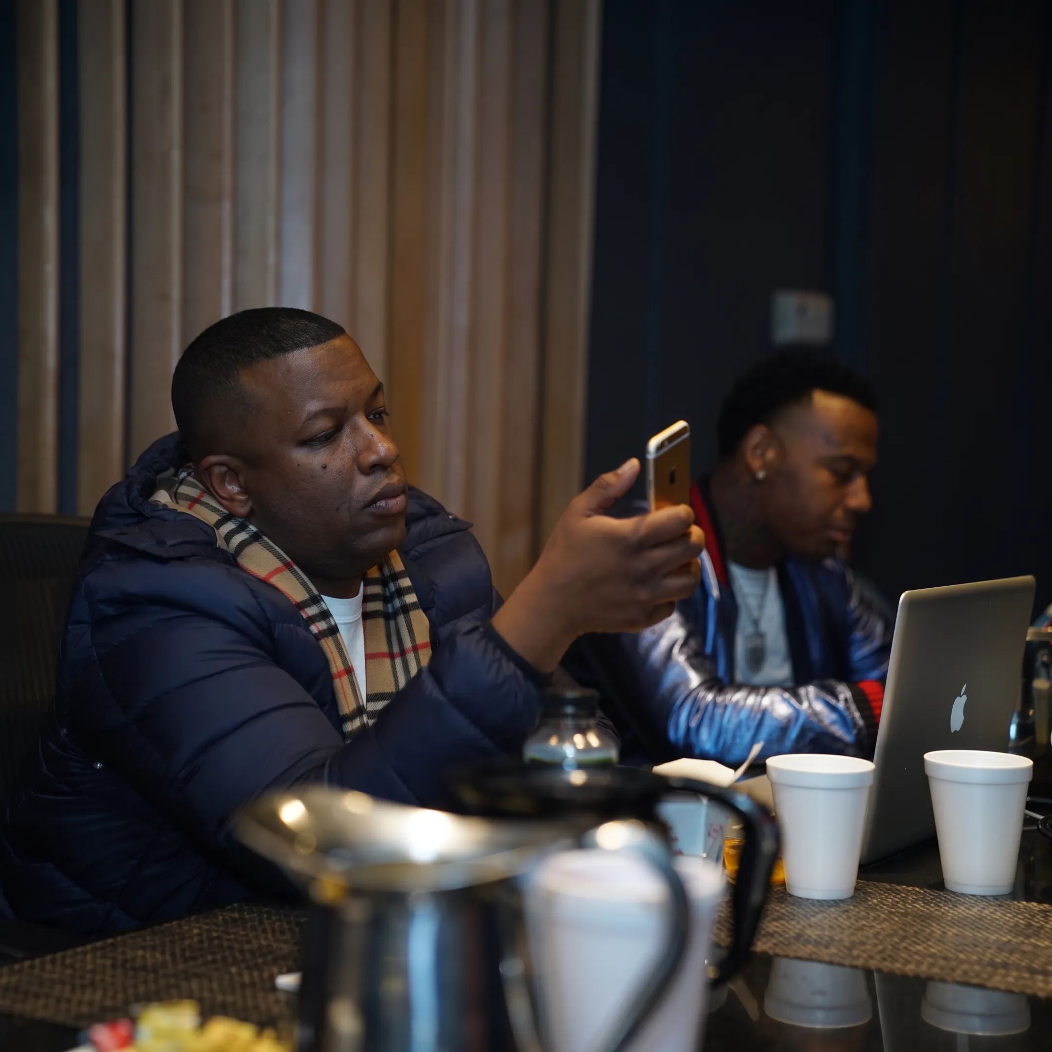 Artist management team planning a concert tour with schedules, venue notes, and promotional materials