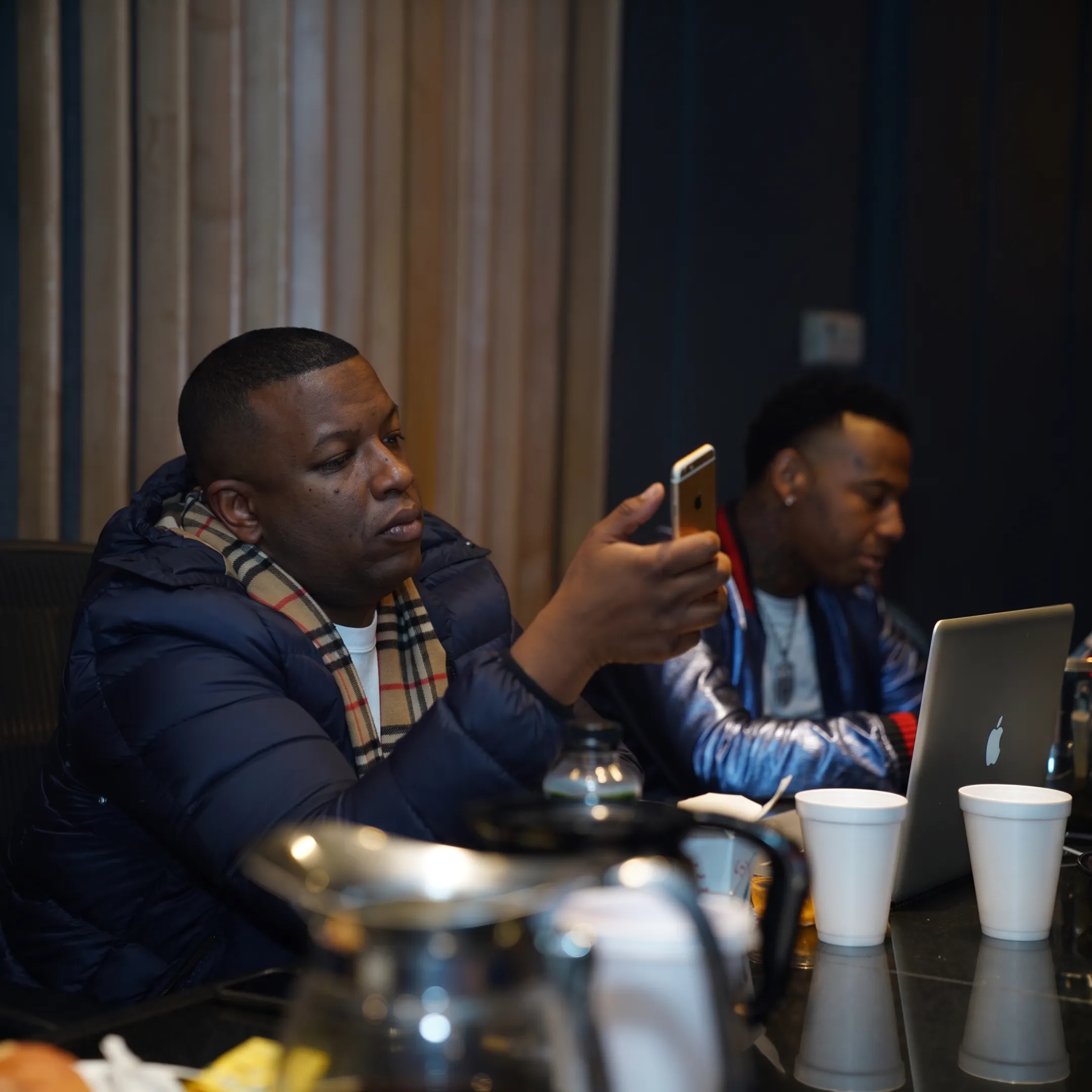 Music marketing team discussing an artist release campaign in a Chicago creative studio
