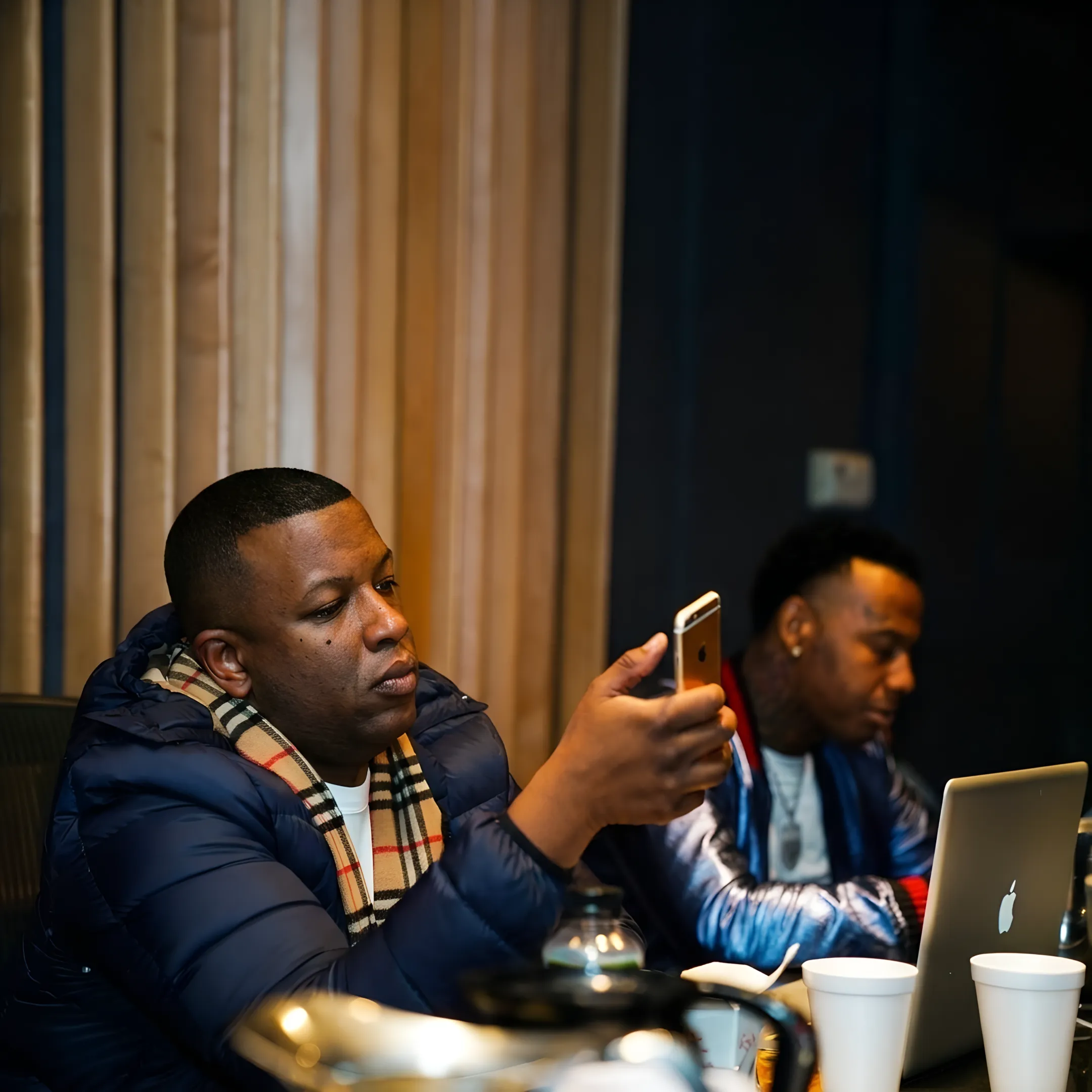 Artist reviewing a music marketing campaign with an experienced consultant