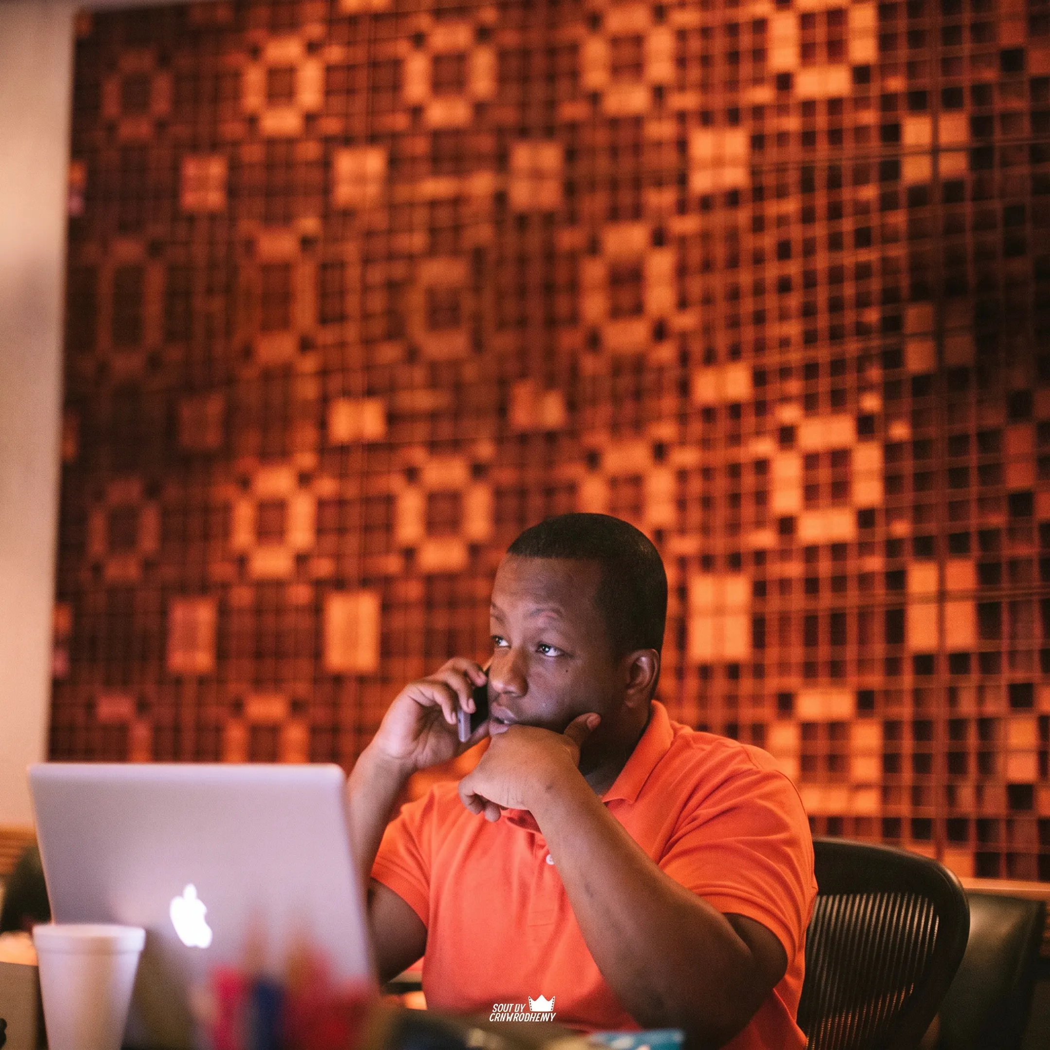 Artist and entertainment manager discussing a live booking strategy in a studio