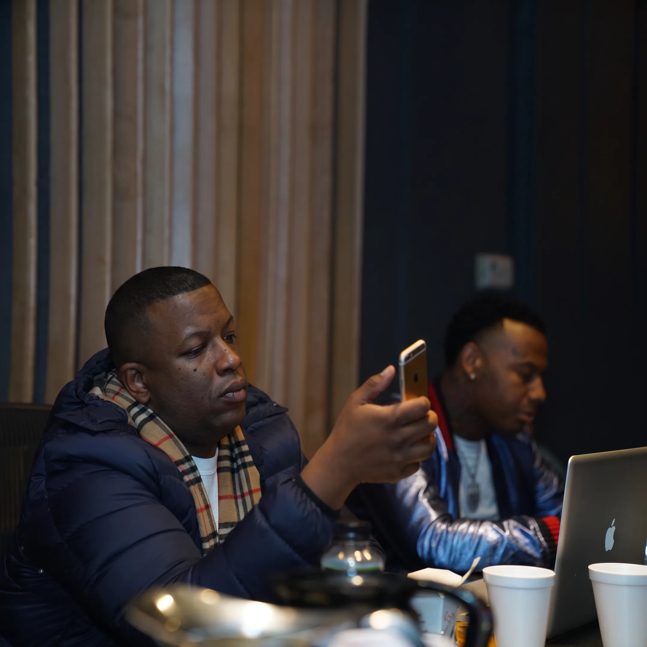 Artist manager meeting with a musician in a Houston recording studio