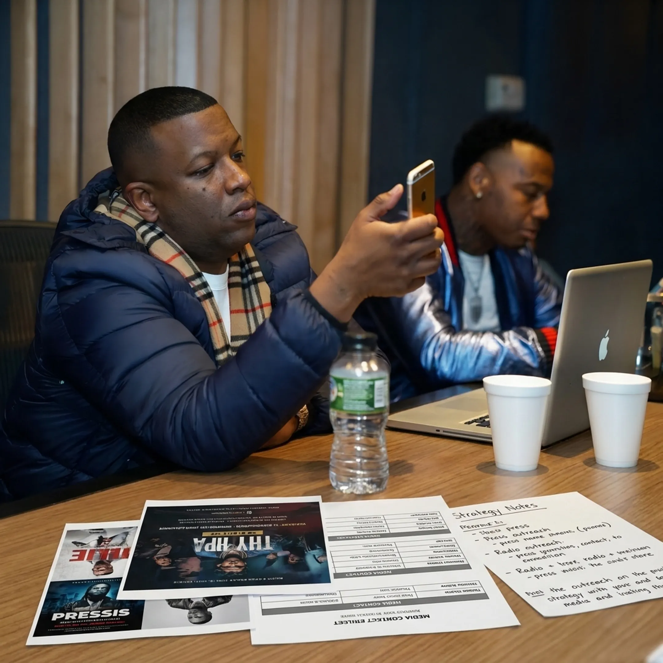 Music PR team planning an artist release campaign with media notes and promotional materials