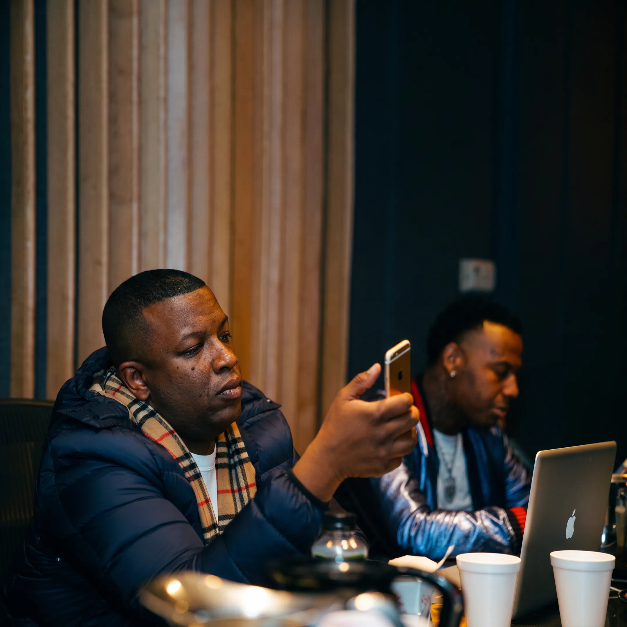 Music publicist reviewing an independent artist release strategy in a creative Oakland studio