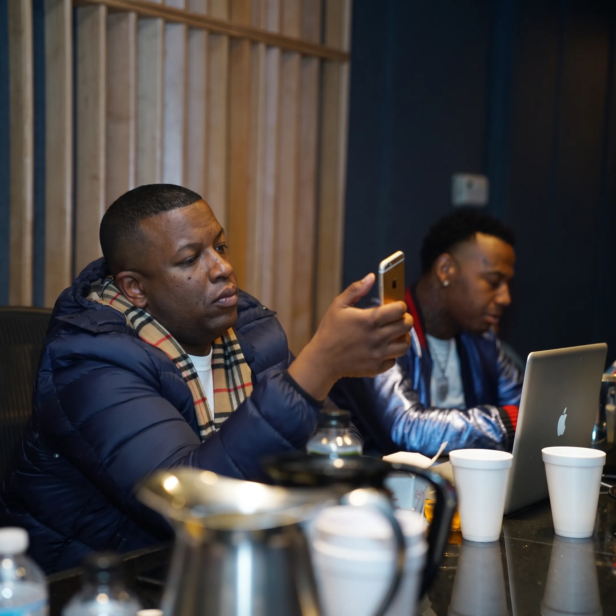 Artist manager consulting with a musician in a professional Orlando studio