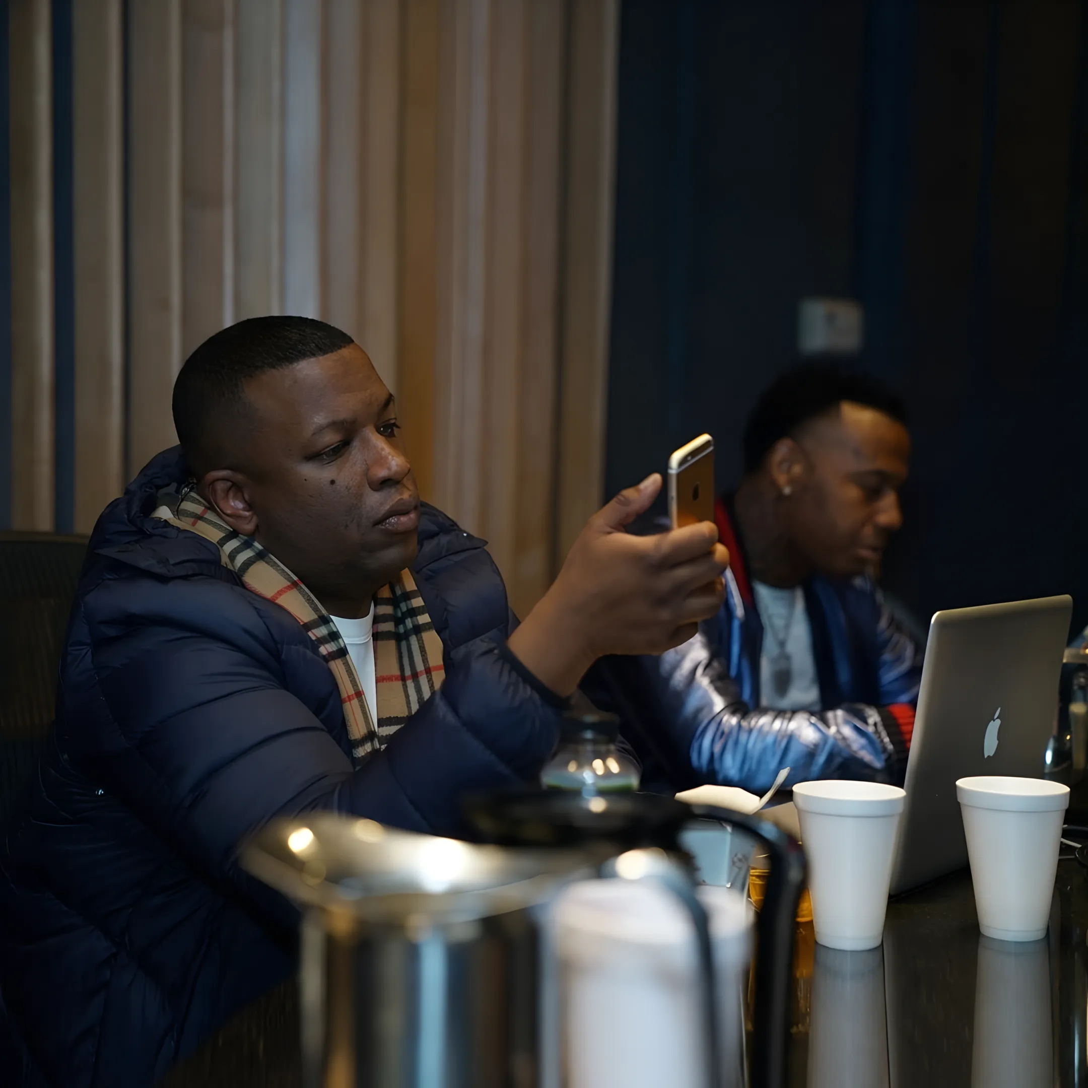 Independent recording artist discussing release plans with an experienced music manager