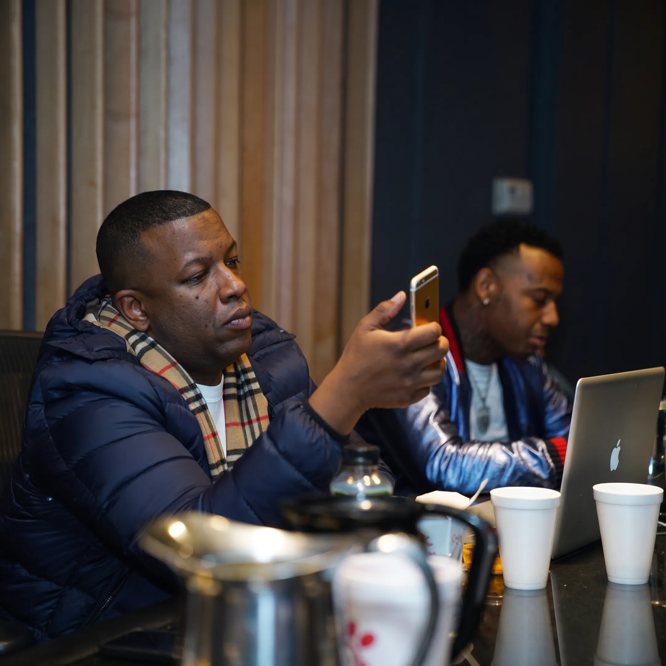 Independent artist working with music promotion consultant during a release strategy meeting