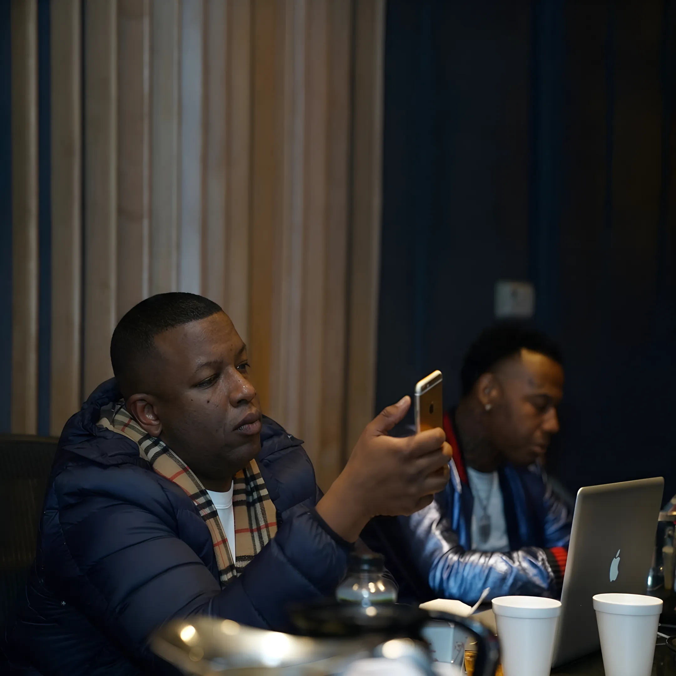 Booking professional discussing an independent hip hop performance with an event organizer