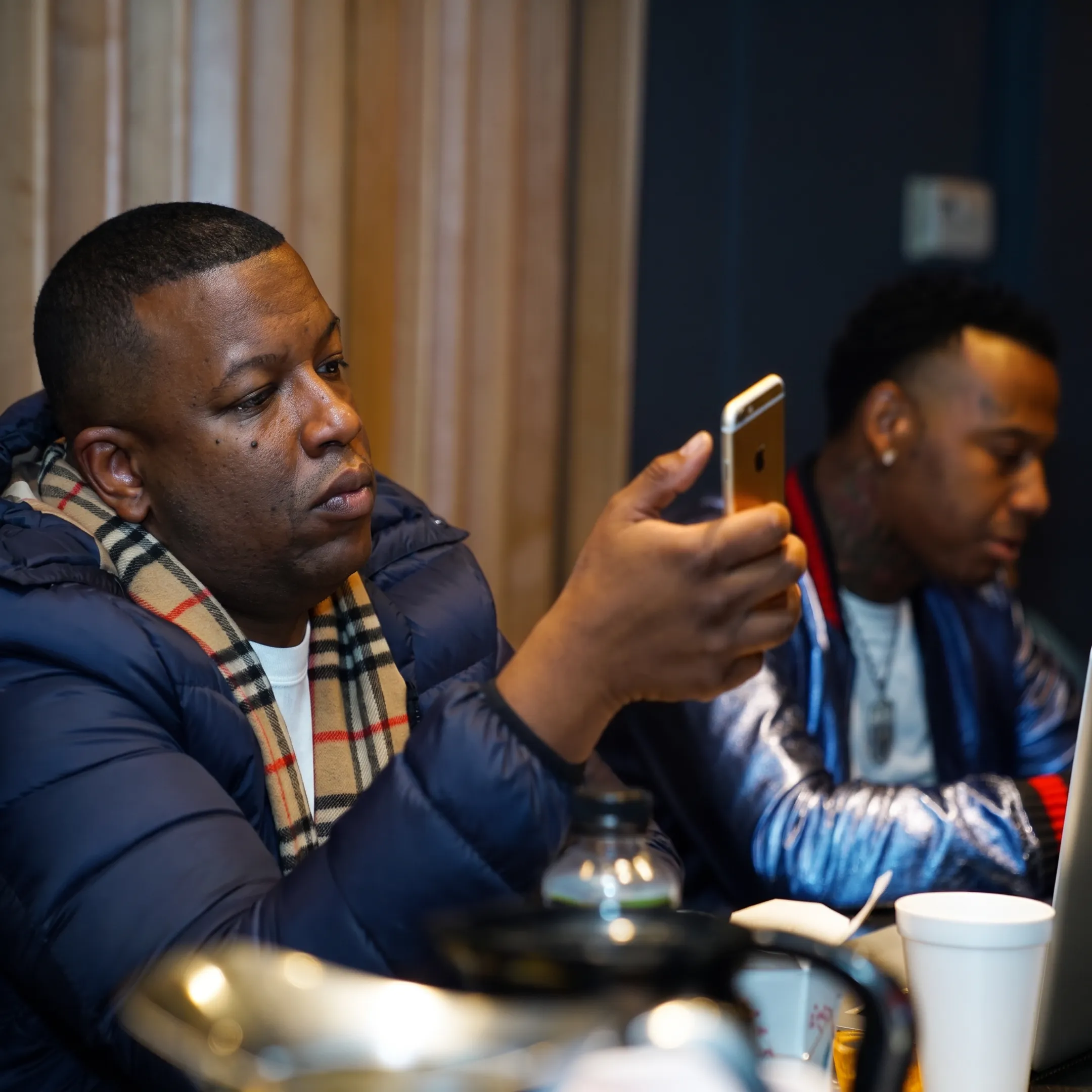 Music manager meeting with recording artist to discuss career growth and release strategy
