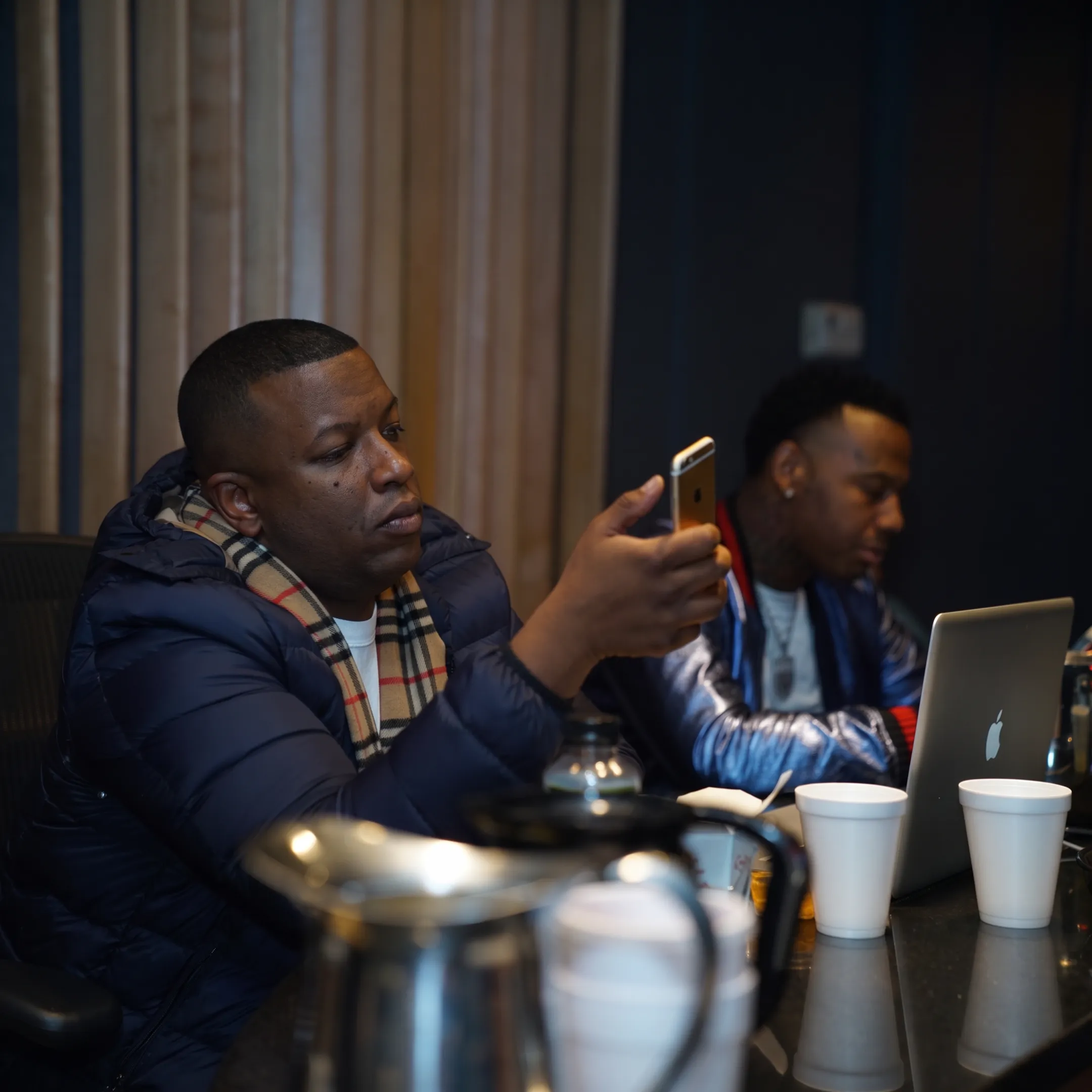 Artist manager advising a musician during a studio consultation