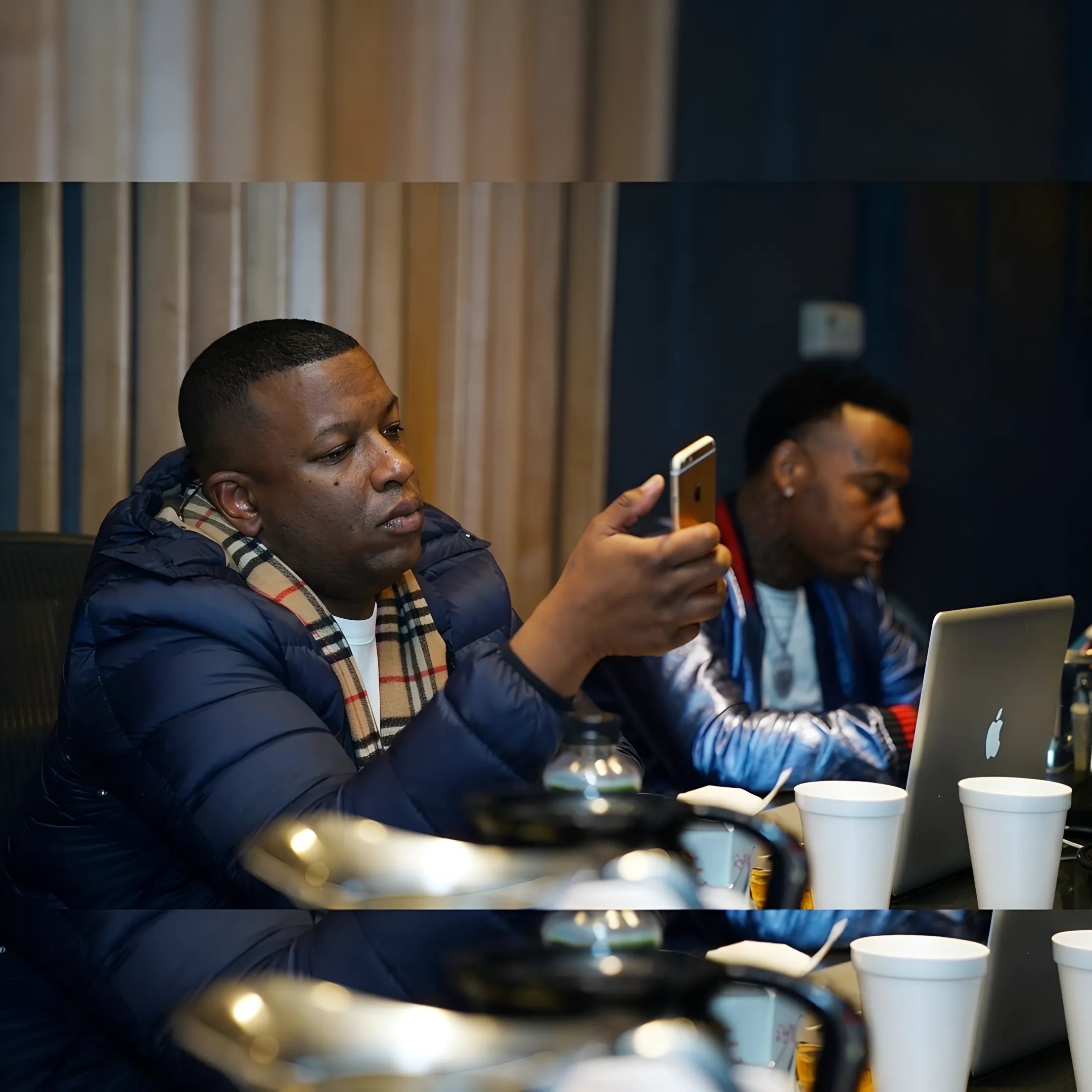 Artist and music consultant planning a release campaign beside promotional materials