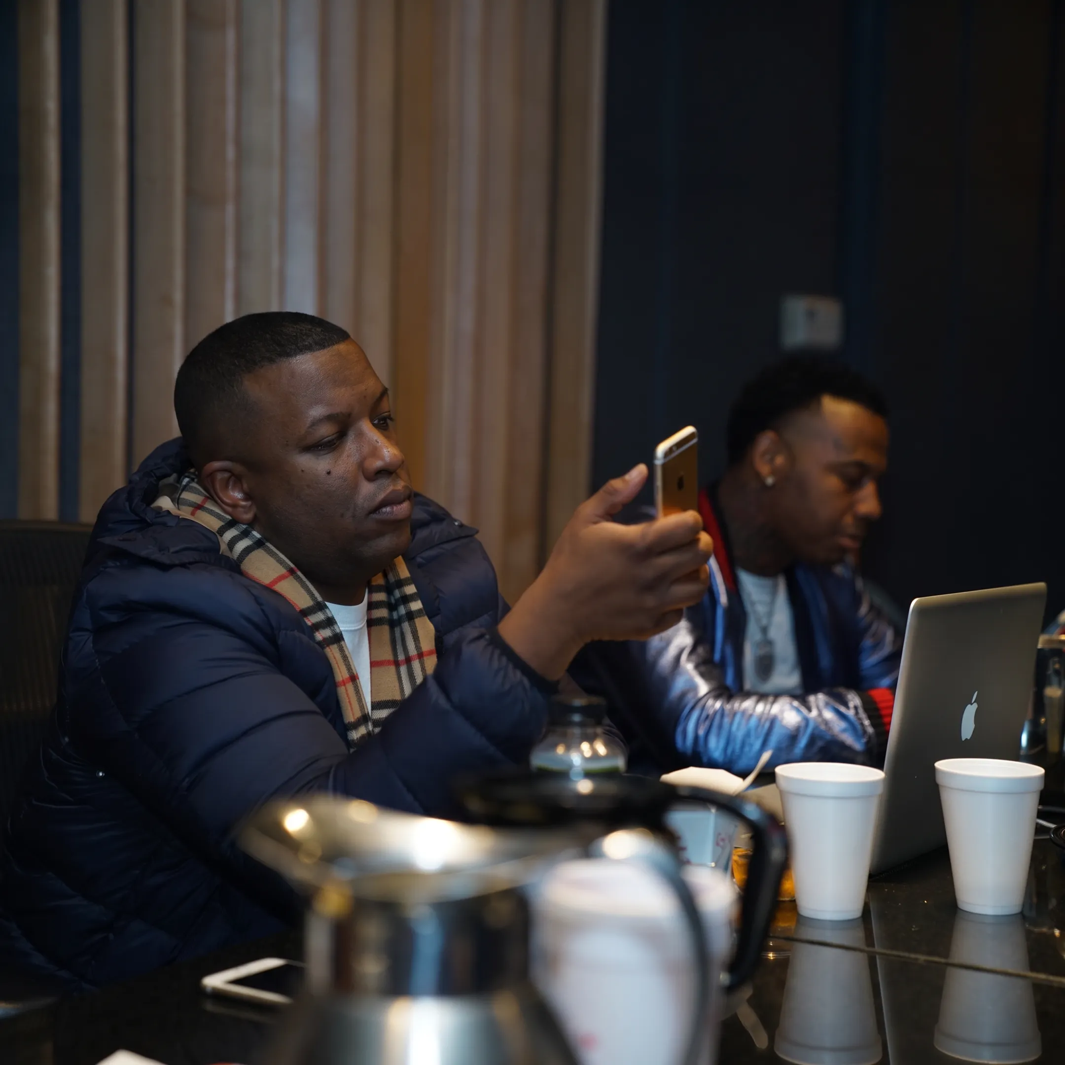 Artist and manager reviewing a music release strategy together