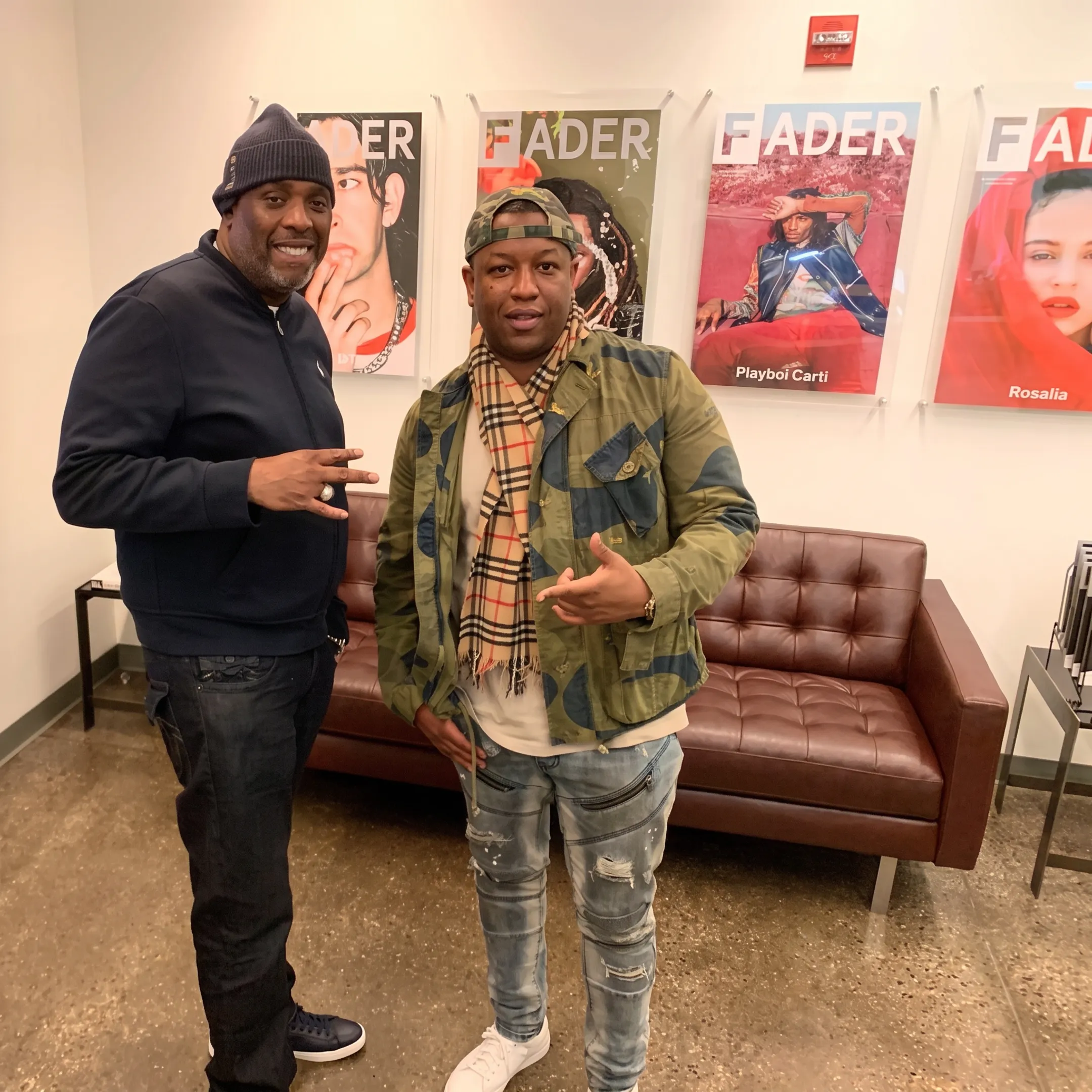 Musician planning social media content with marketing consultant in a creative studio