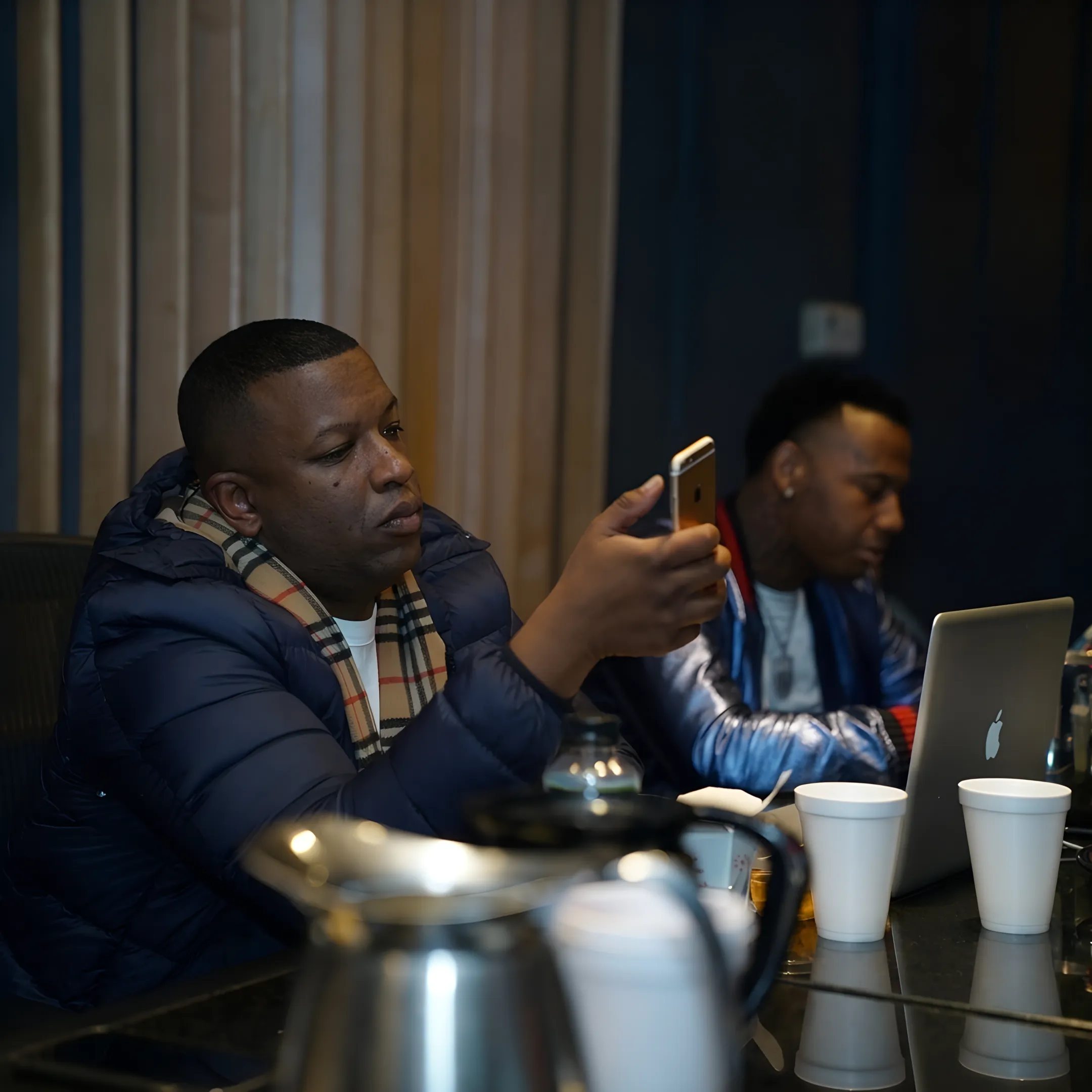 Music release strategist presenting a campaign plan to an artist in a creative workspace