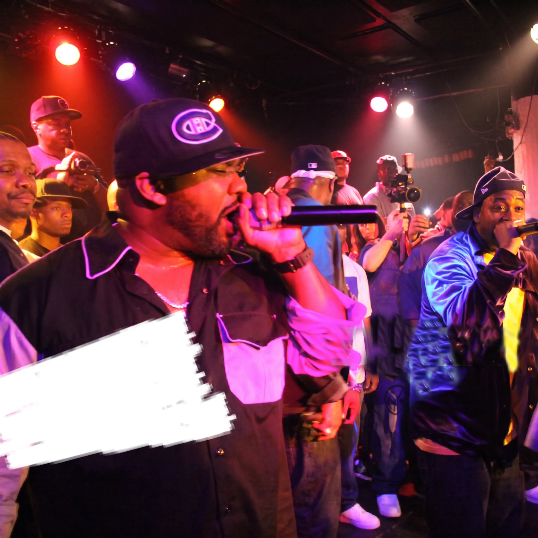 Artist performing onstage before an engaged concert audience