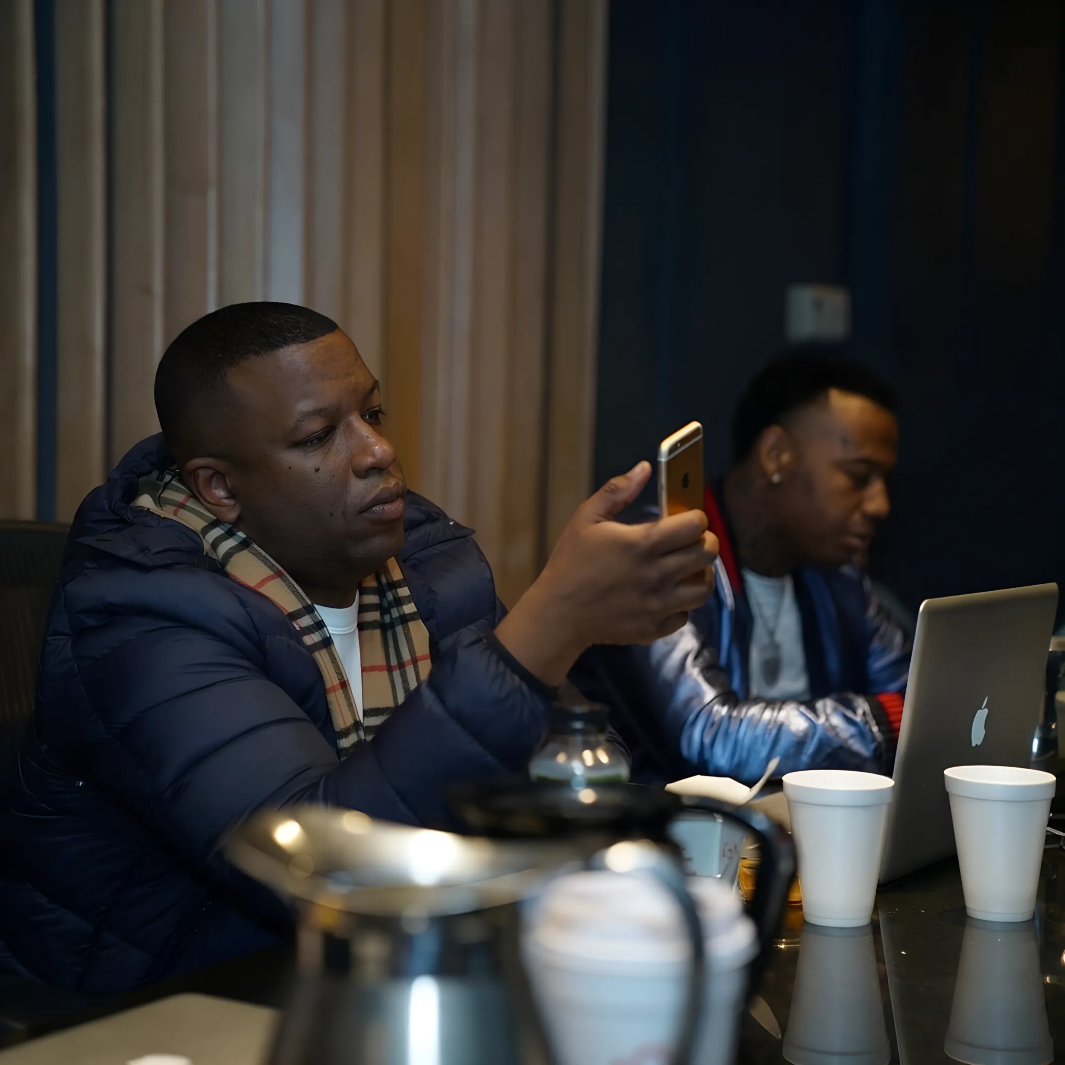 Music manager meeting with recording artist to discuss career strategy and release planning