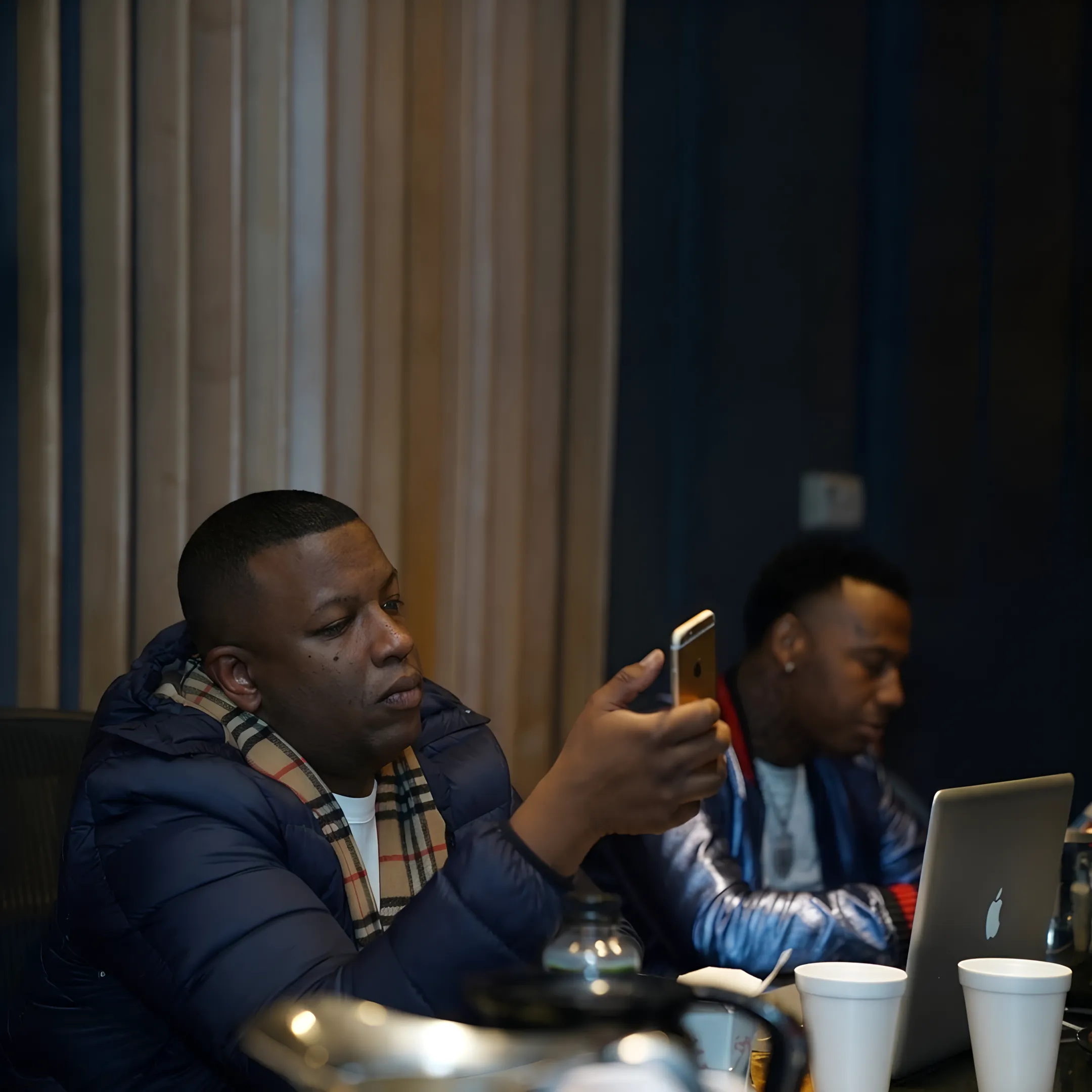 Artist and music manager reviewing branding and touring plans during a strategy session