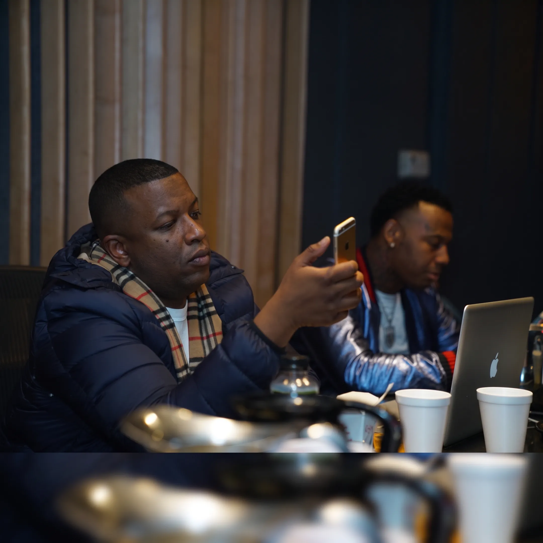 Creative team planning an album release campaign with music artwork and promotional materials