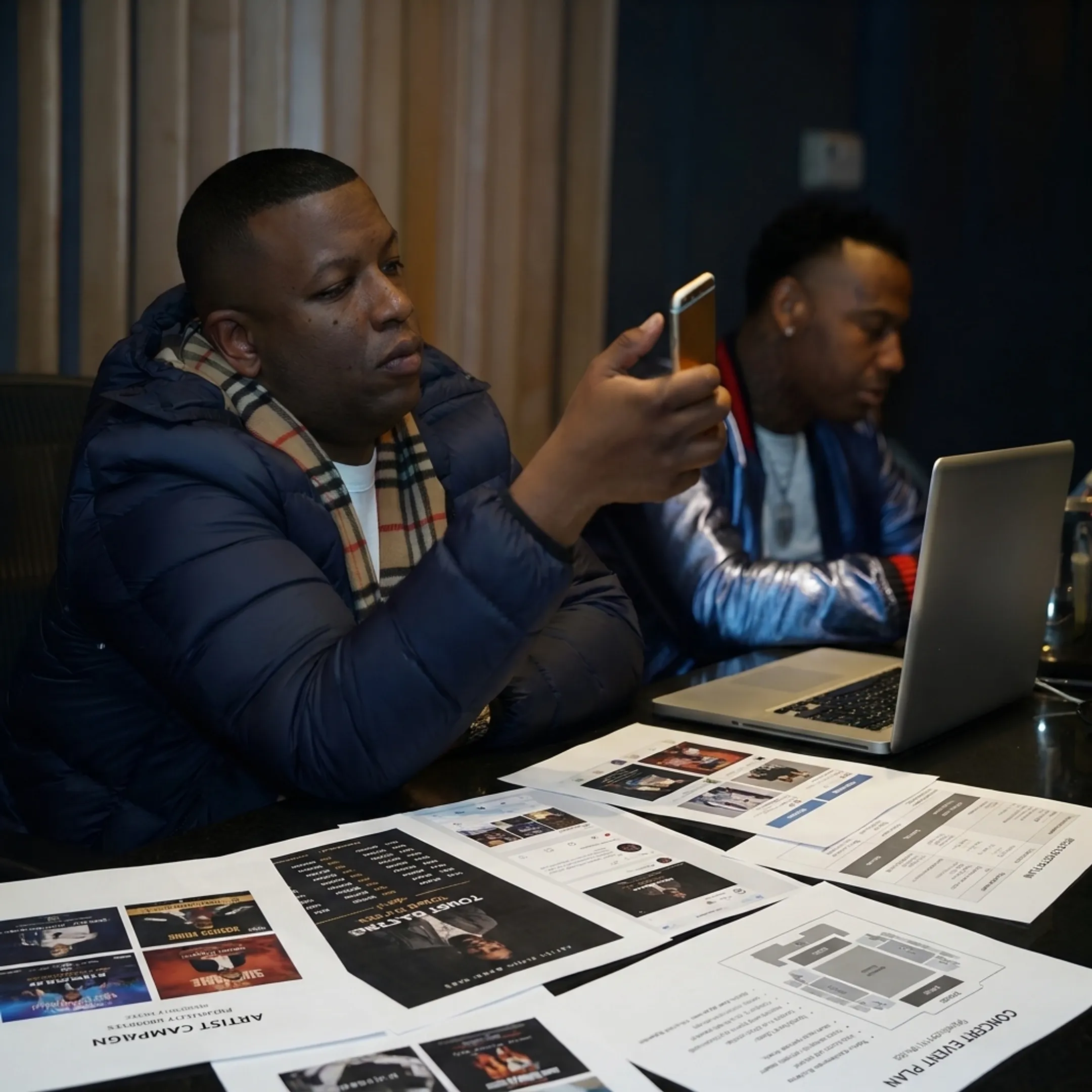 Entertainment marketing professionals coordinating artist promotion and live event campaign materials