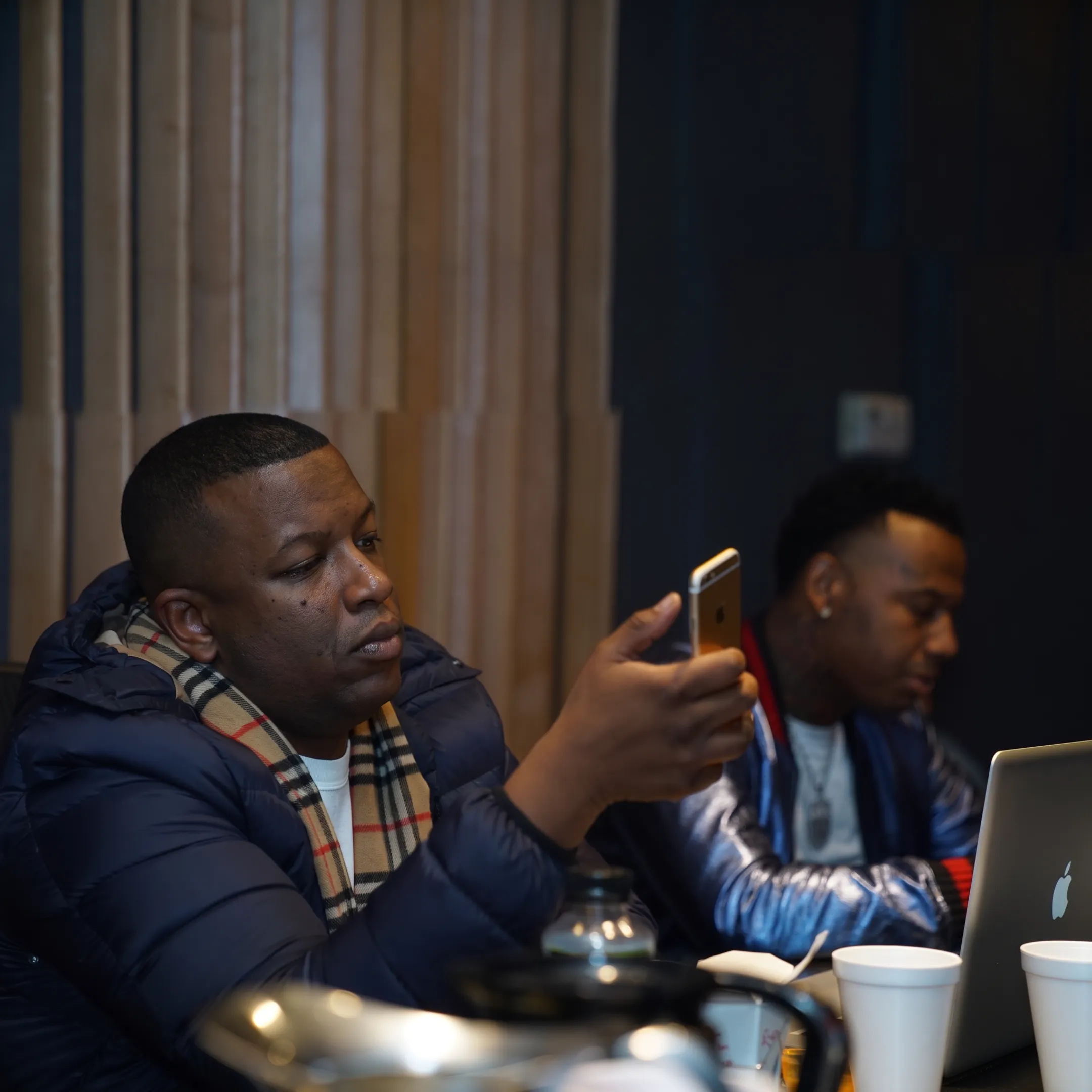Artist manager reviewing a rapper’s career strategy and promotional materials