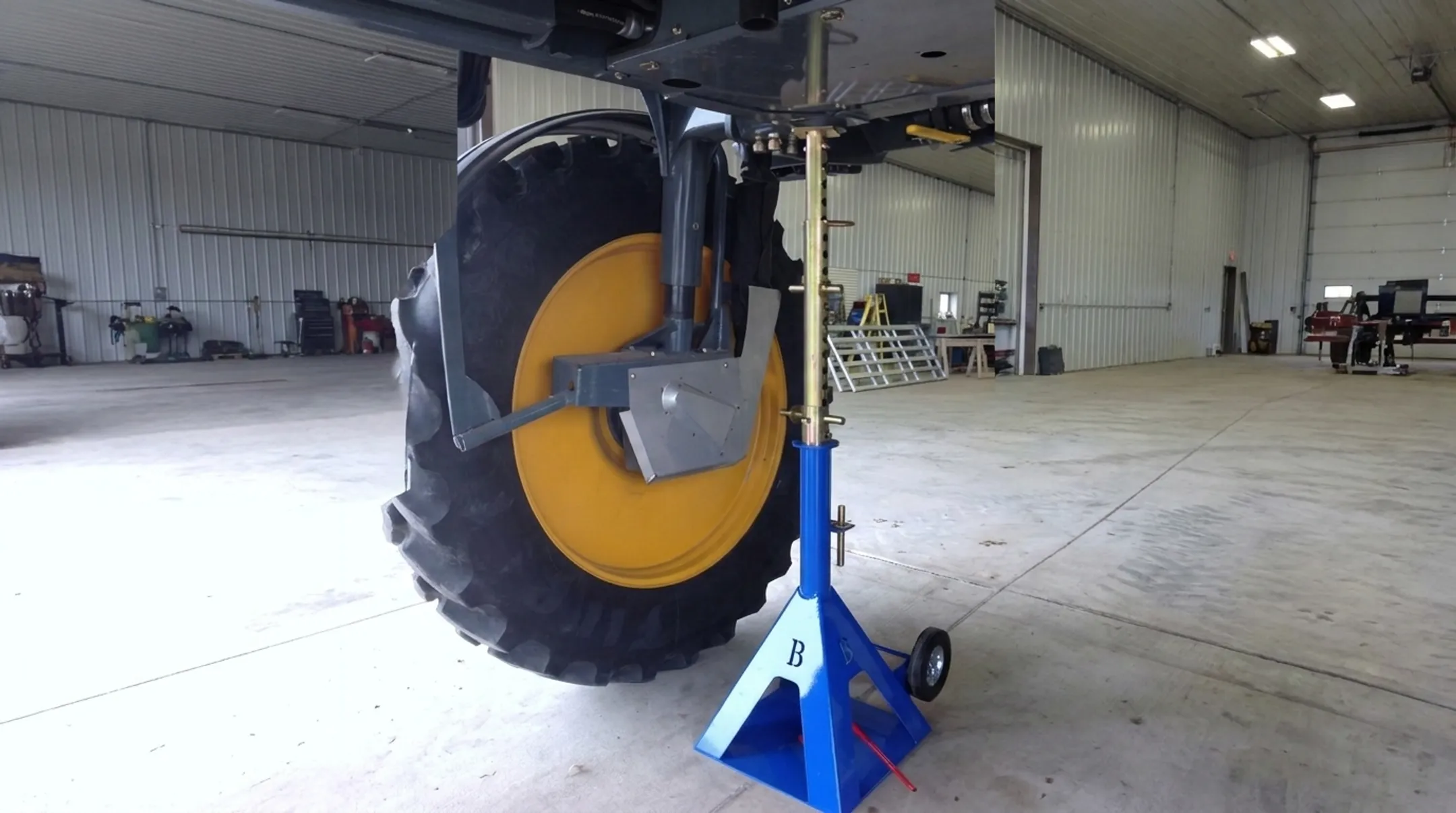 EZ Dual Changer handling large combine tire in service bay