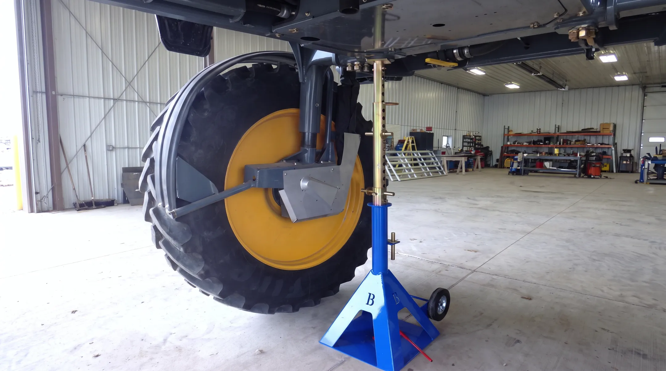 EZ Dual Changer handling agricultural tractor dual wheel assembly