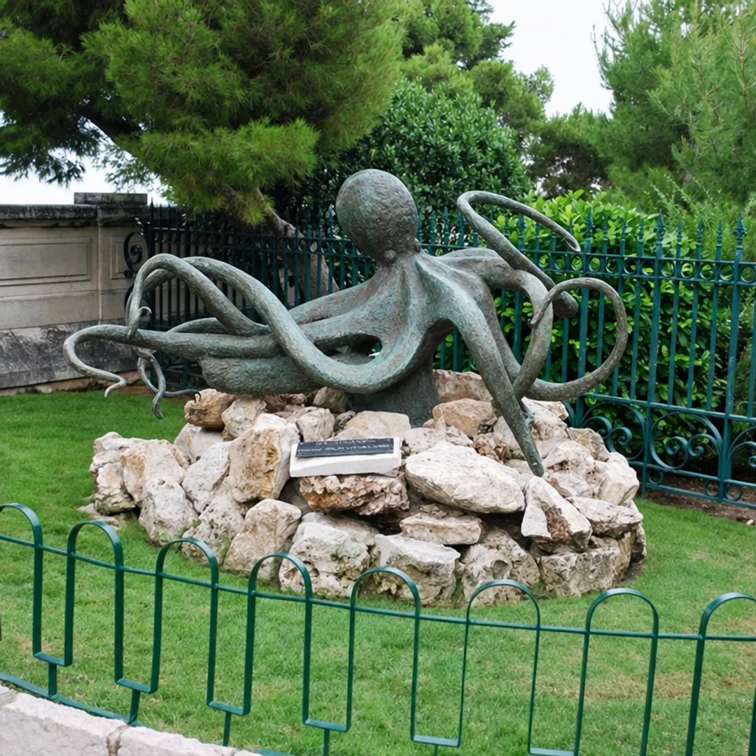 Large bronze octopus sculpture with weathered green patina outdoors