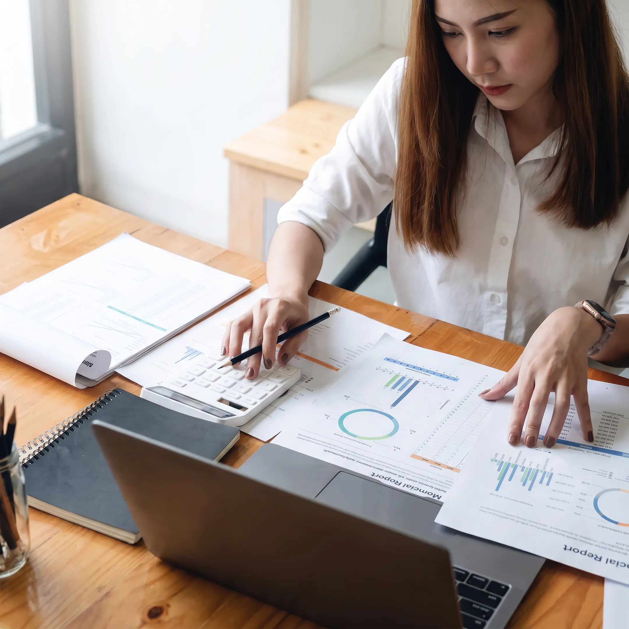 Valuation professional reviewing healthcare business financial documents