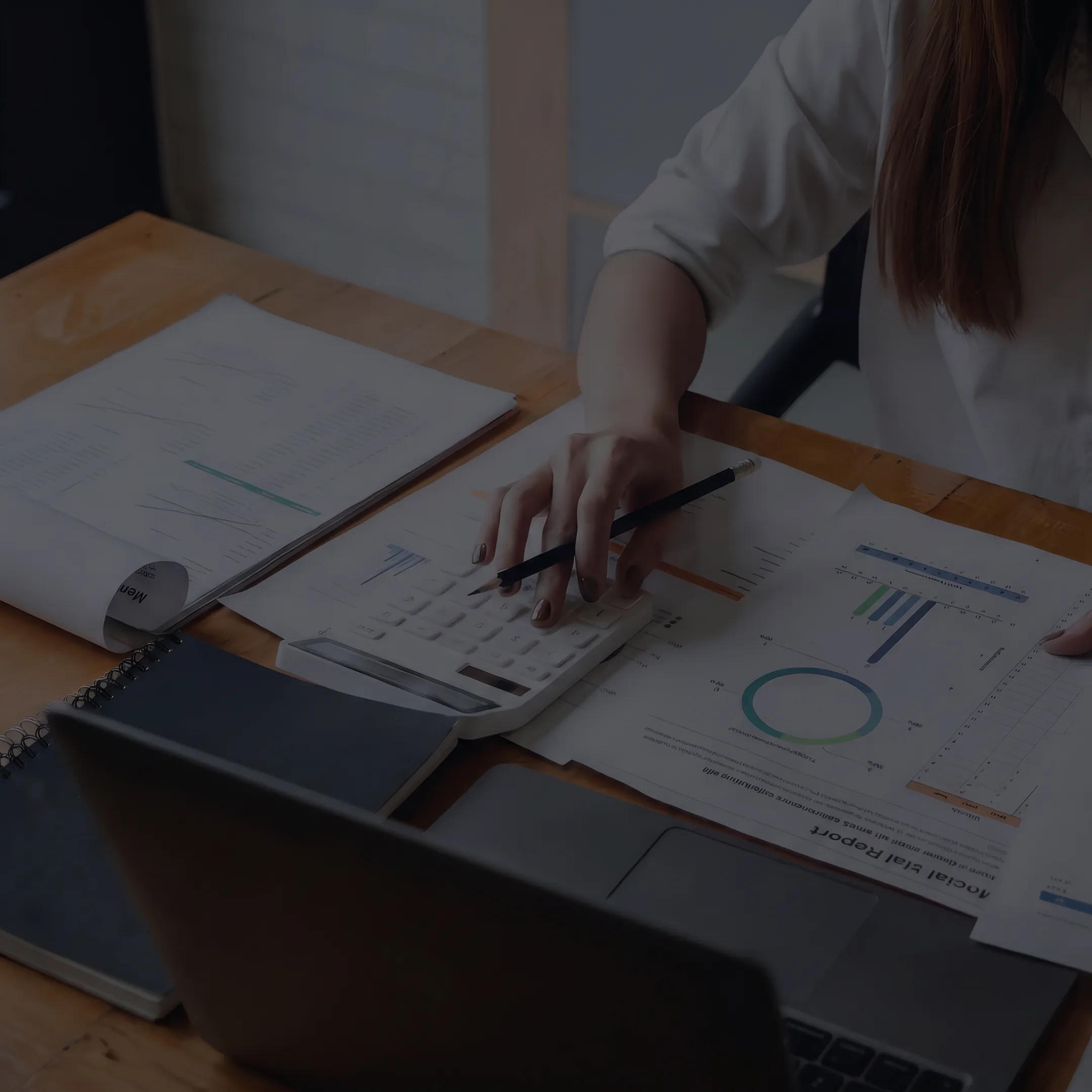 Business valuator analyzing dental practice performance and valuation data