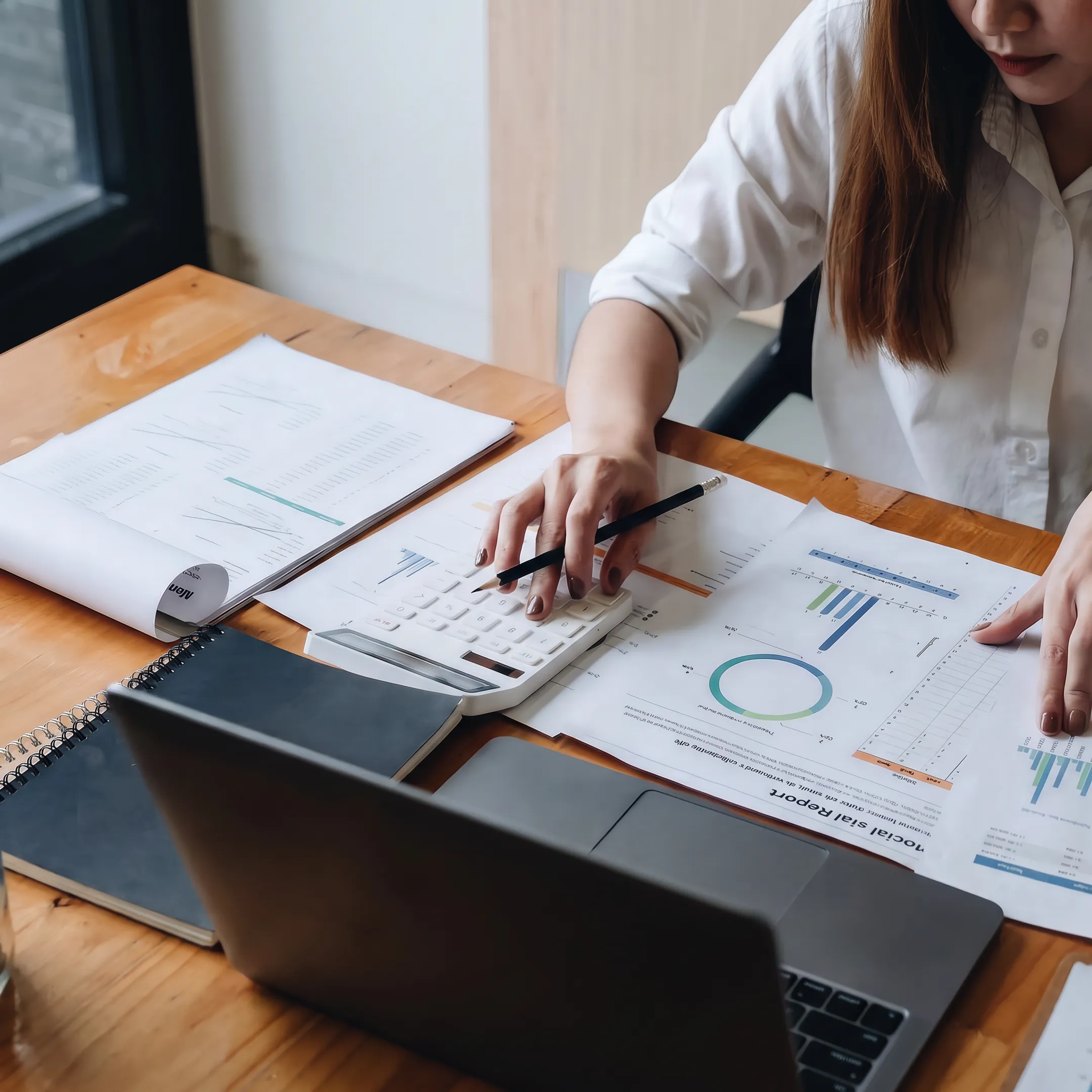 Valuator reviewing private business valuation documents with a client