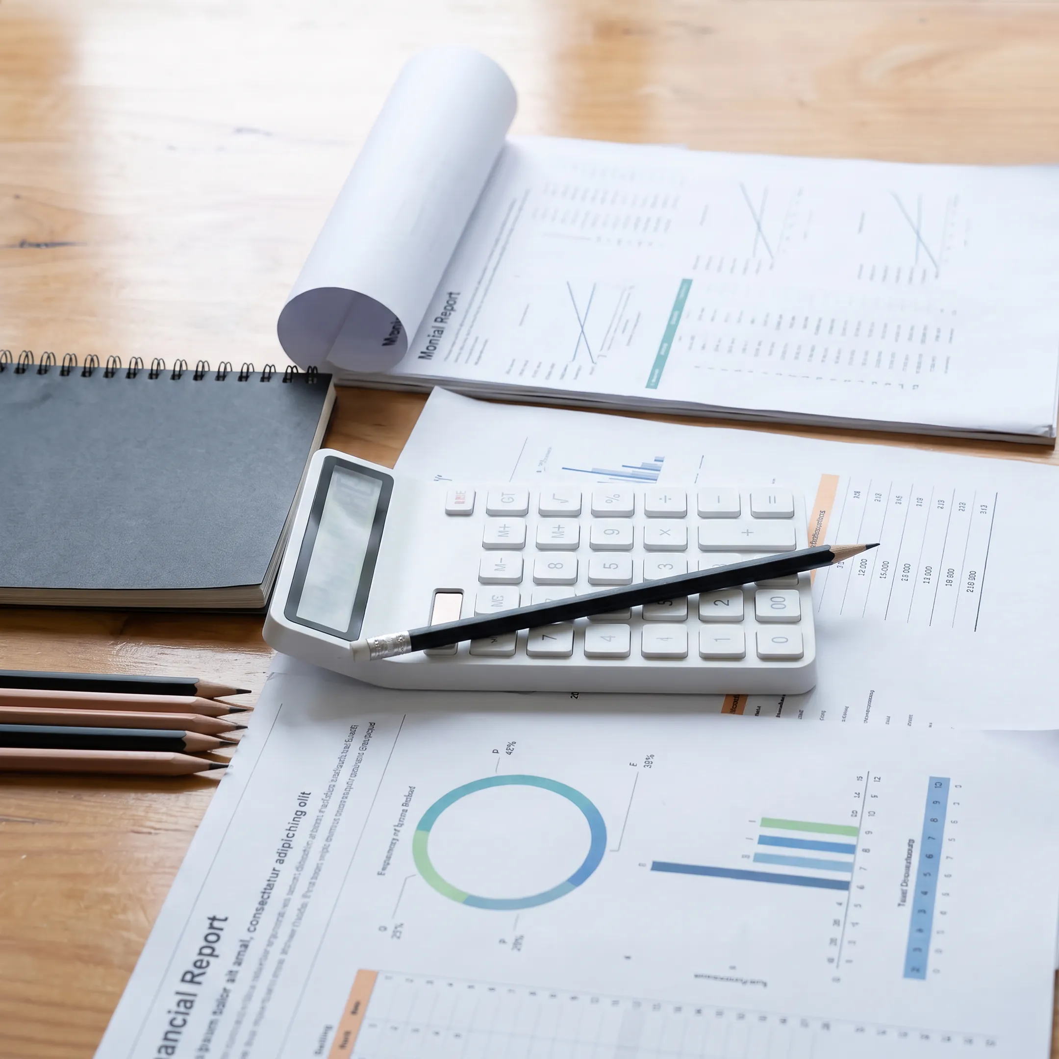 Business valuation report and financial analysis on a desk