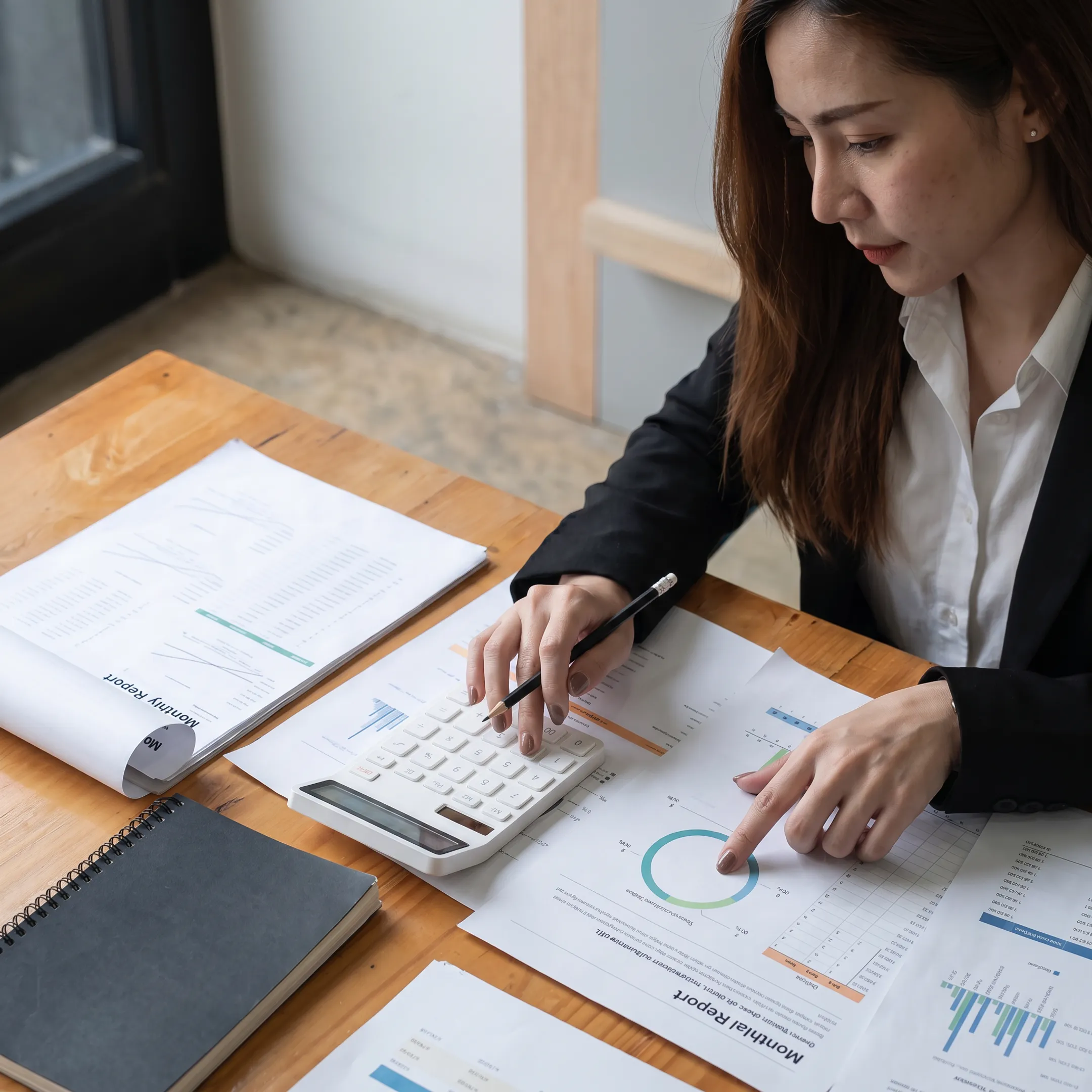 Valuation analyst examining business financial records