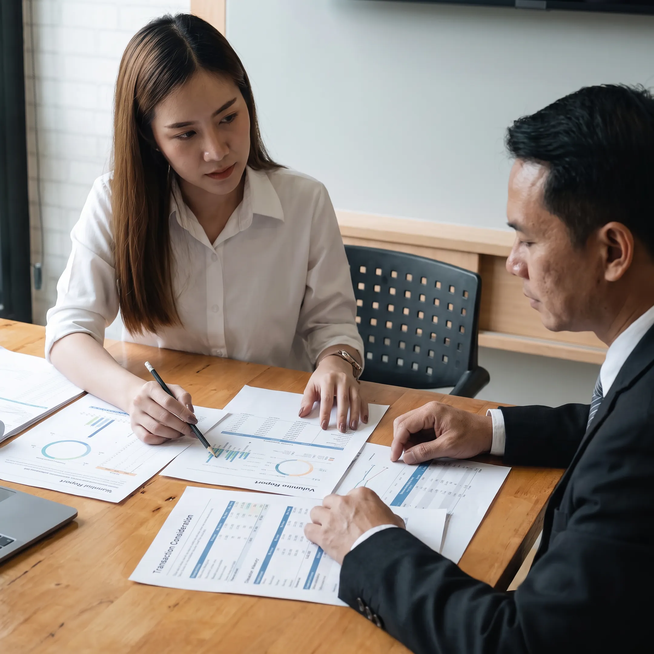 Valuation advisor presenting business analysis to an owner