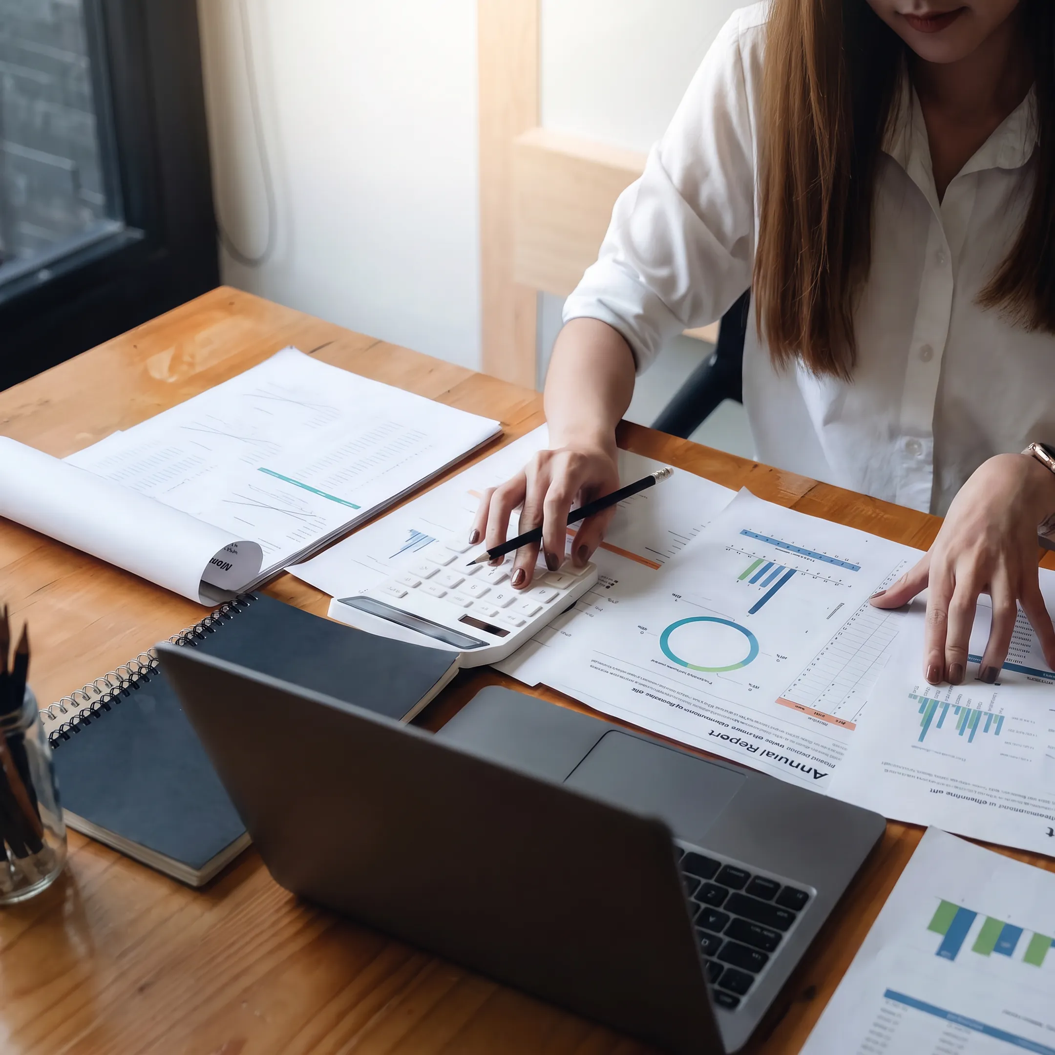 Business valuation advisor reviewing financial documents with a company owner