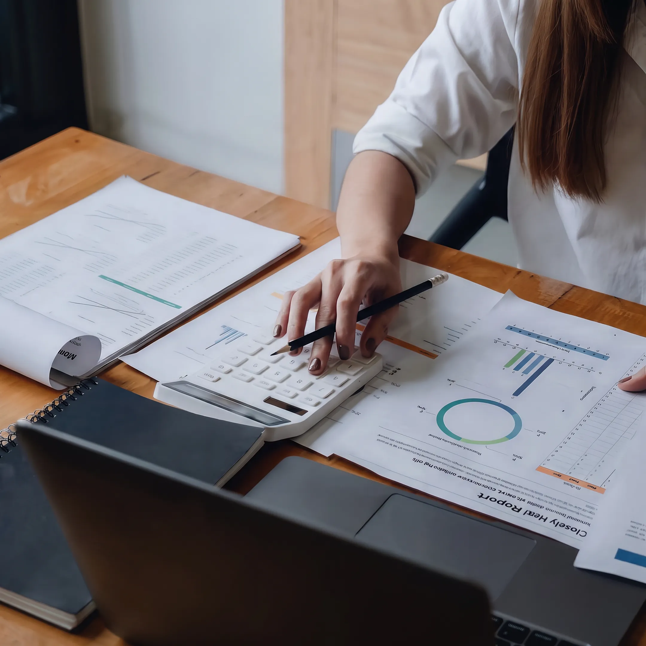 Advisor examining business valuation analysis and compliance records