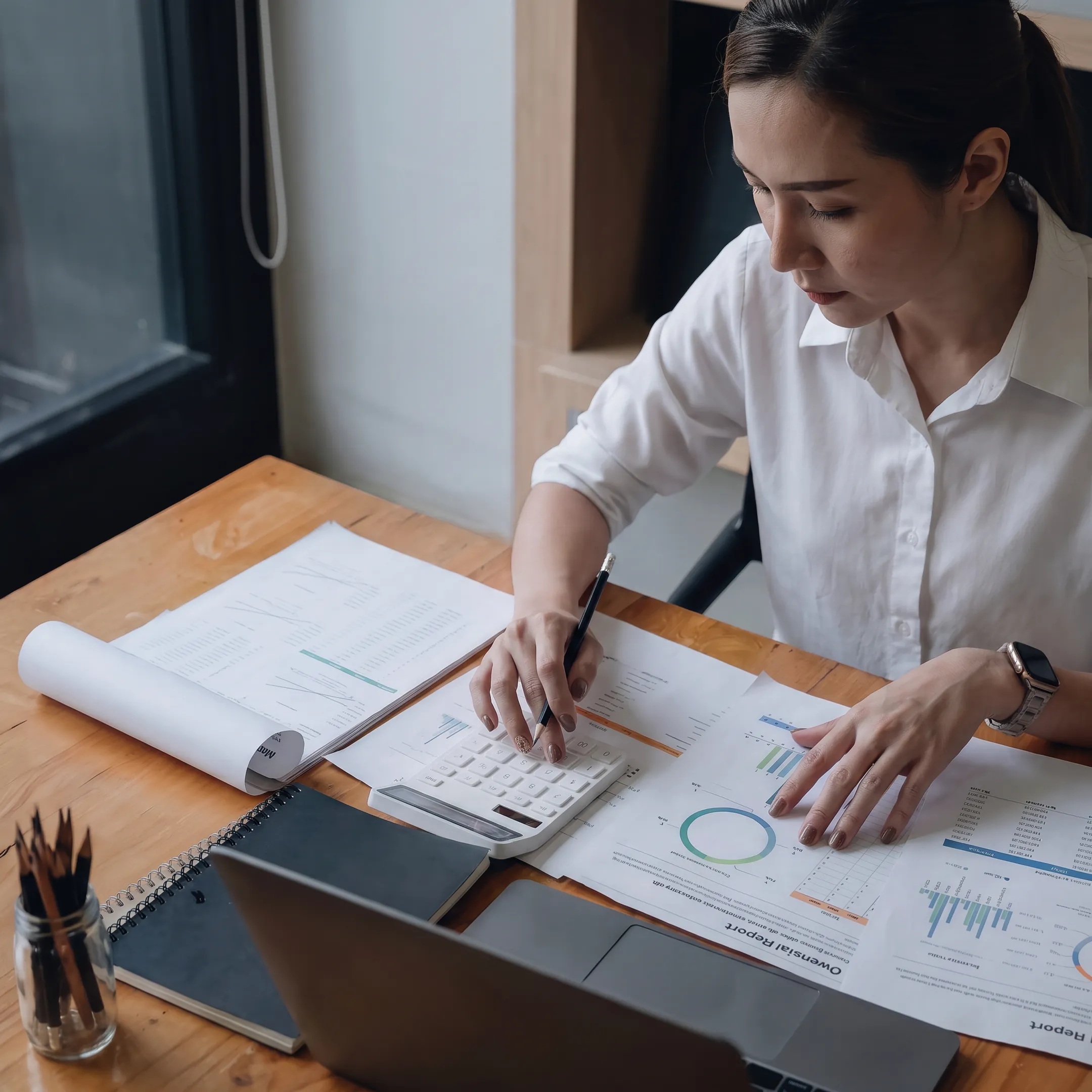 Advisor analyzing retail business valuation data and financial reports