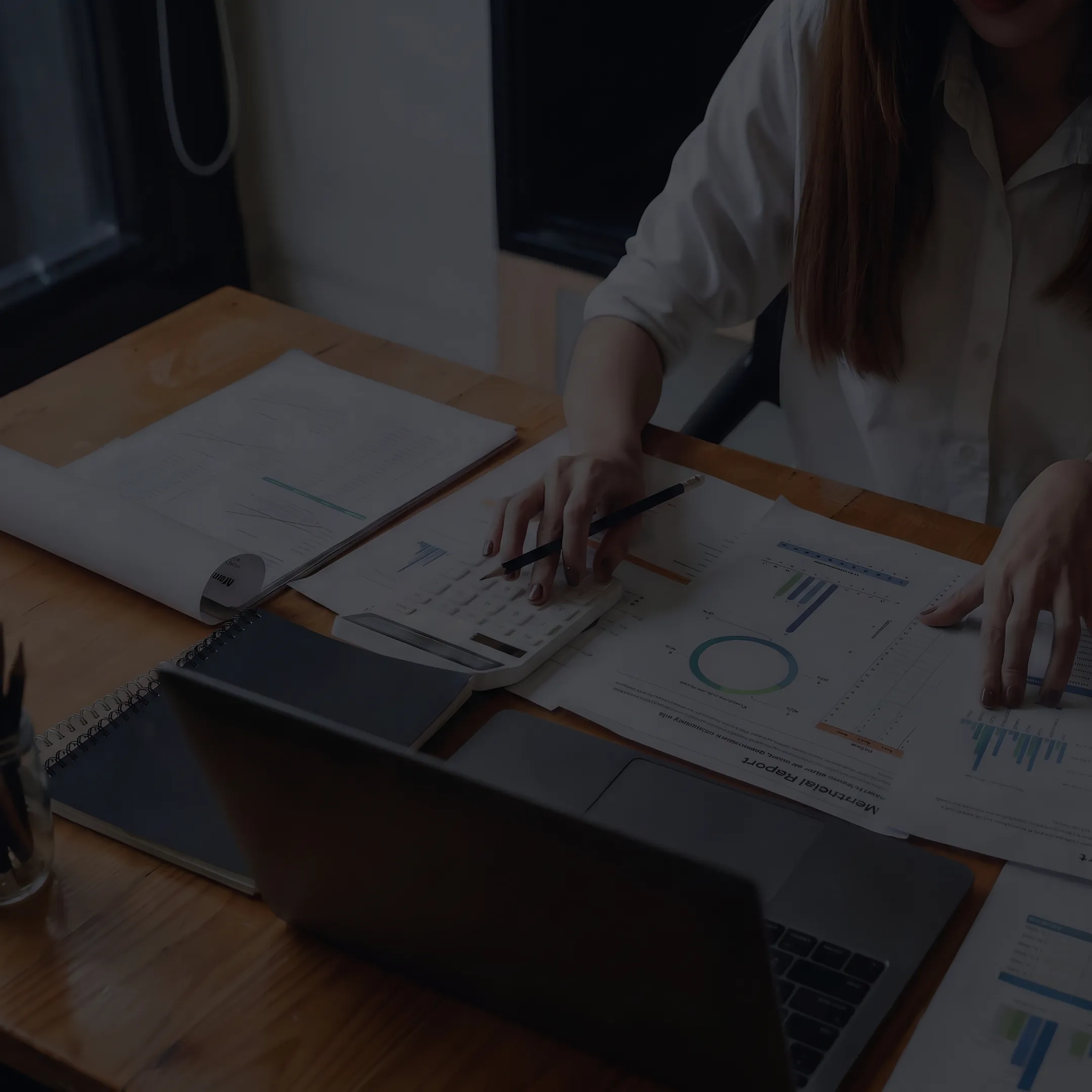 Valuation professional reviewing complex financial documents and securities analysis