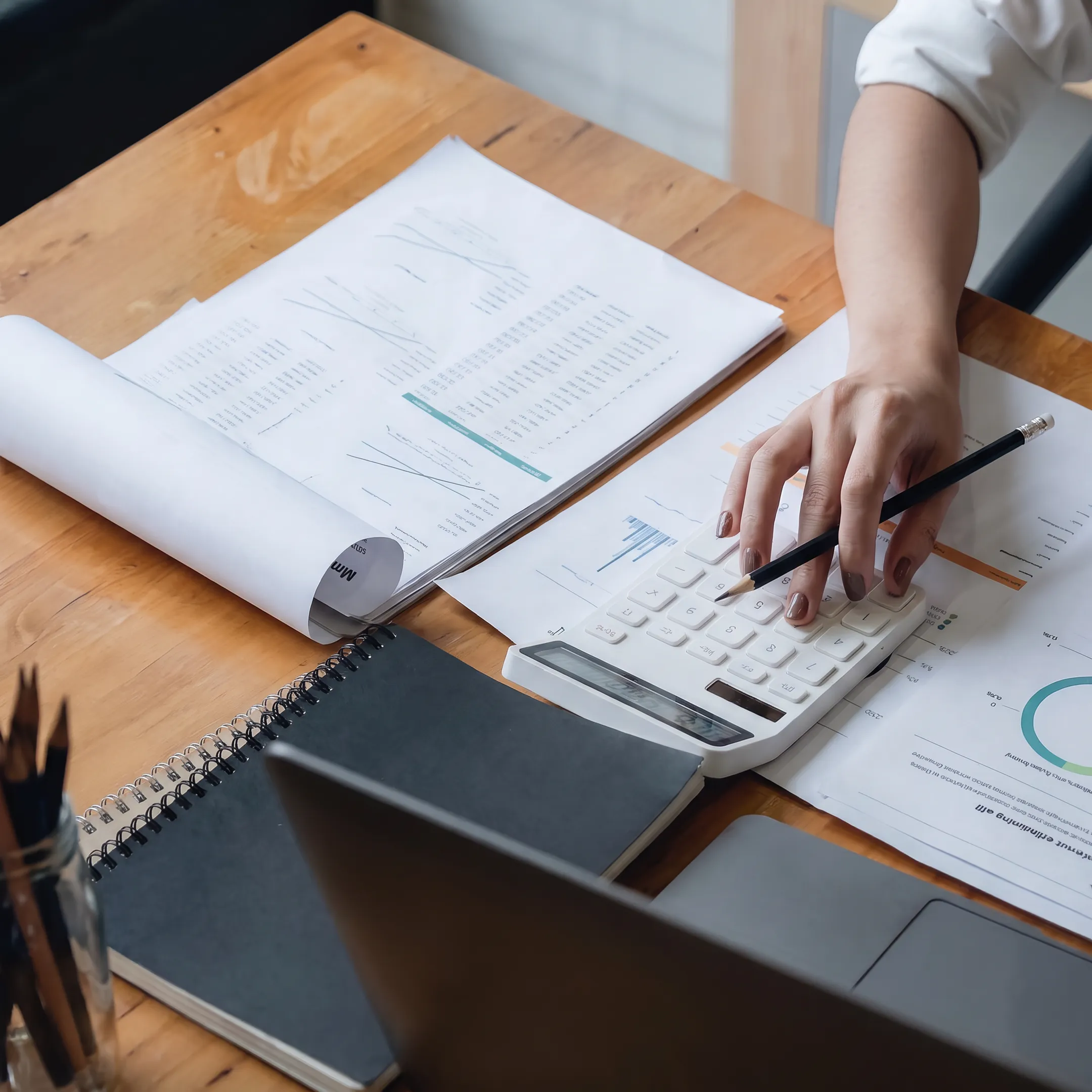 Business valuation report and financial analysis documents on a desk