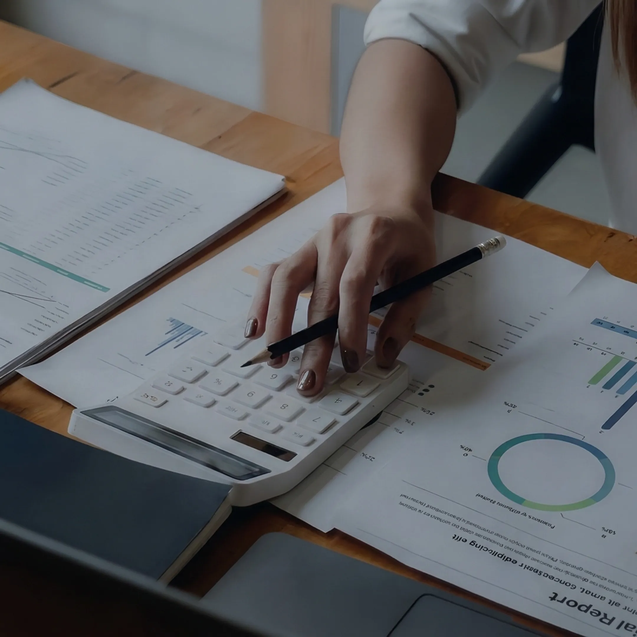 Valuation professional reviewing business financial documents in a Connecticut office setting