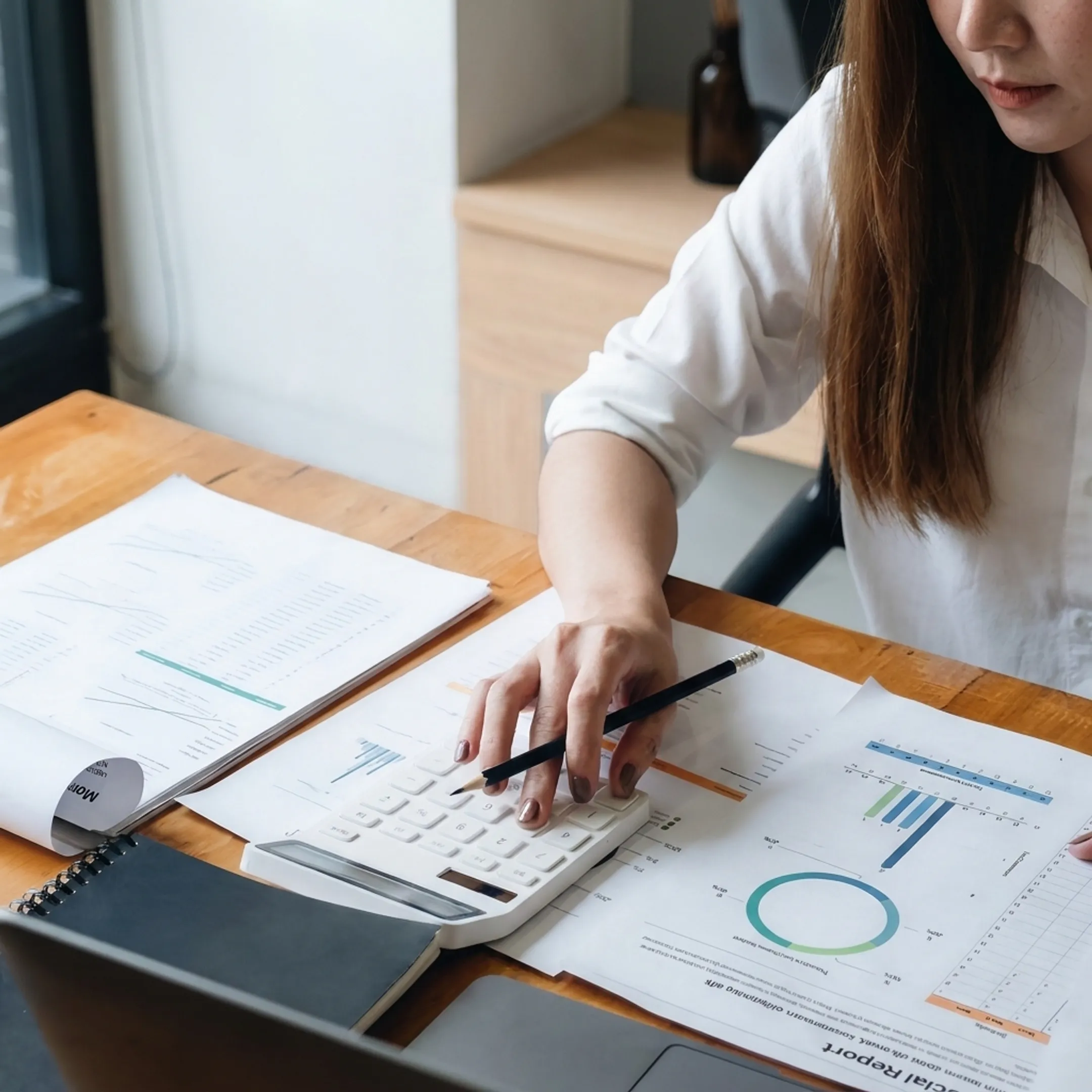 Valuation professional analyzing business records and financial information