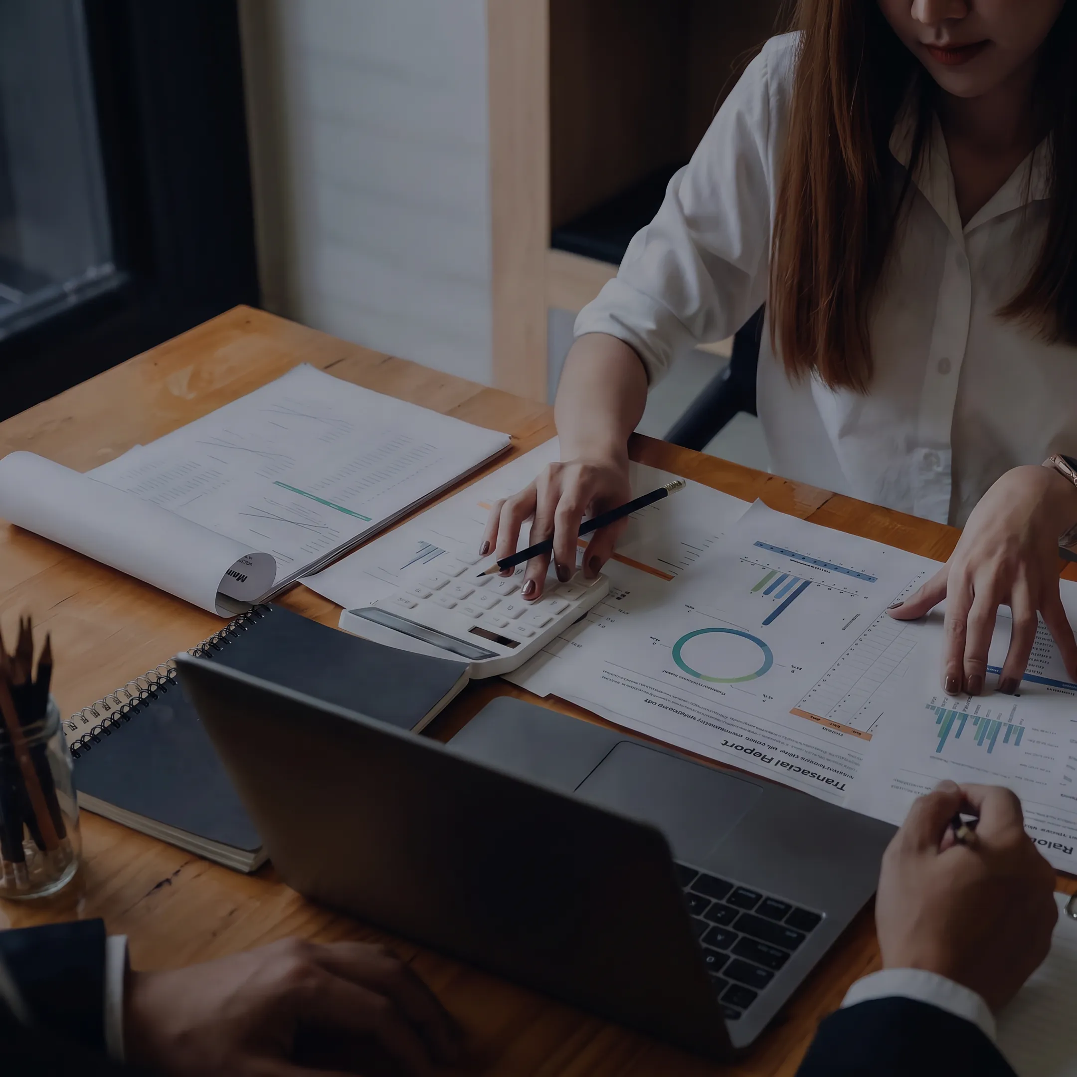 Advisor reviewing a business acquisition valuation with a client