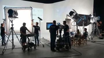 Professional video production crew filming corporate B2B ad on location