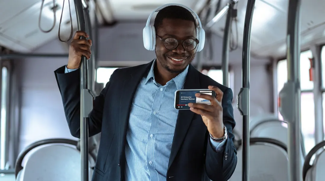 B2B professional watching video testimonial on smartphone during mobile research